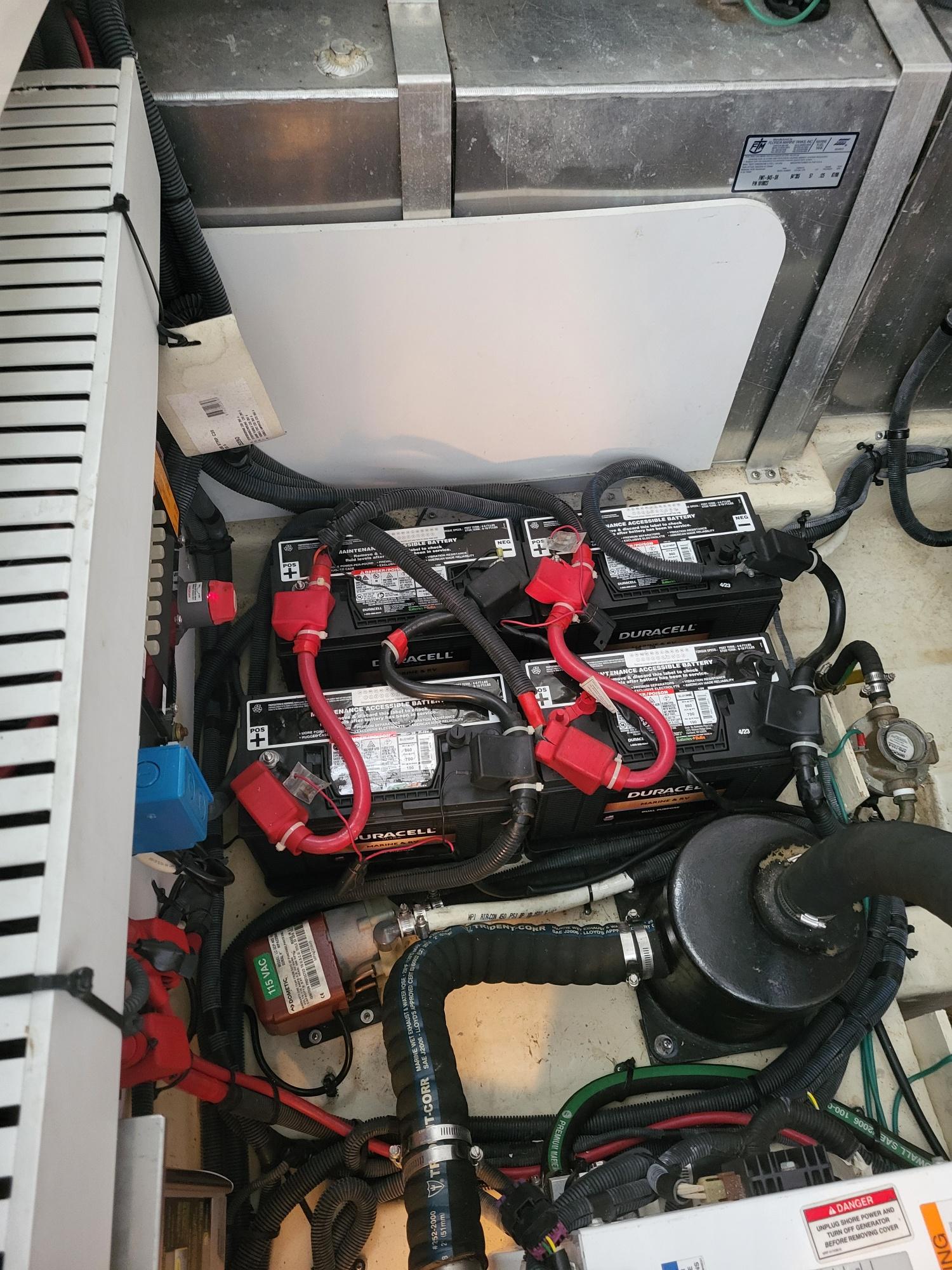 2009 Sea Ray 310 Sundancer engine compartment with Duracell batteries and wiring.
