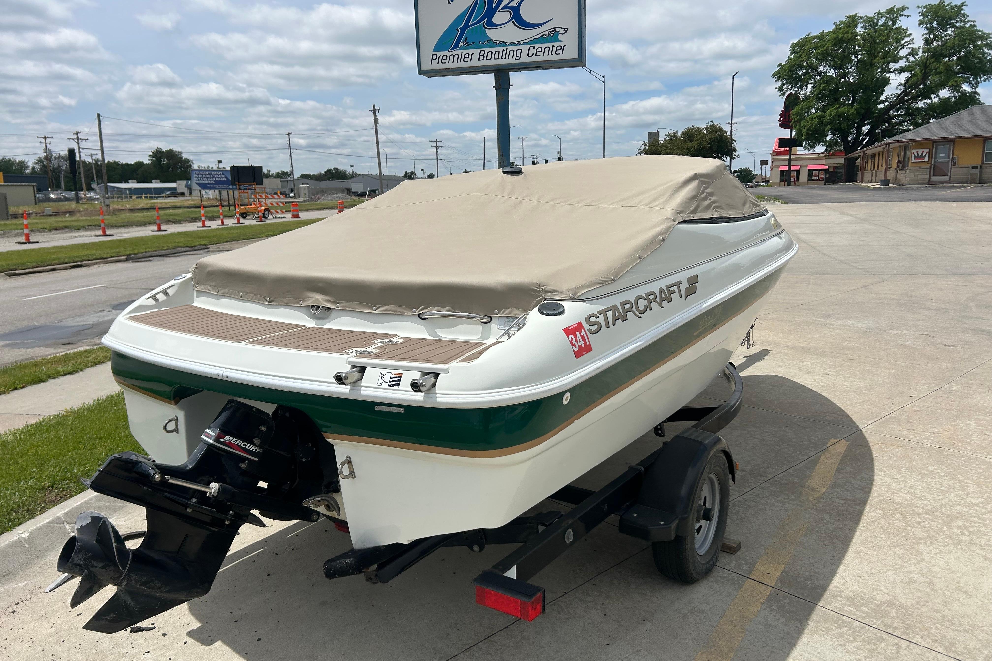 2000 Starcraft 1810 boat with cover on trailer at Premier Boating Center.