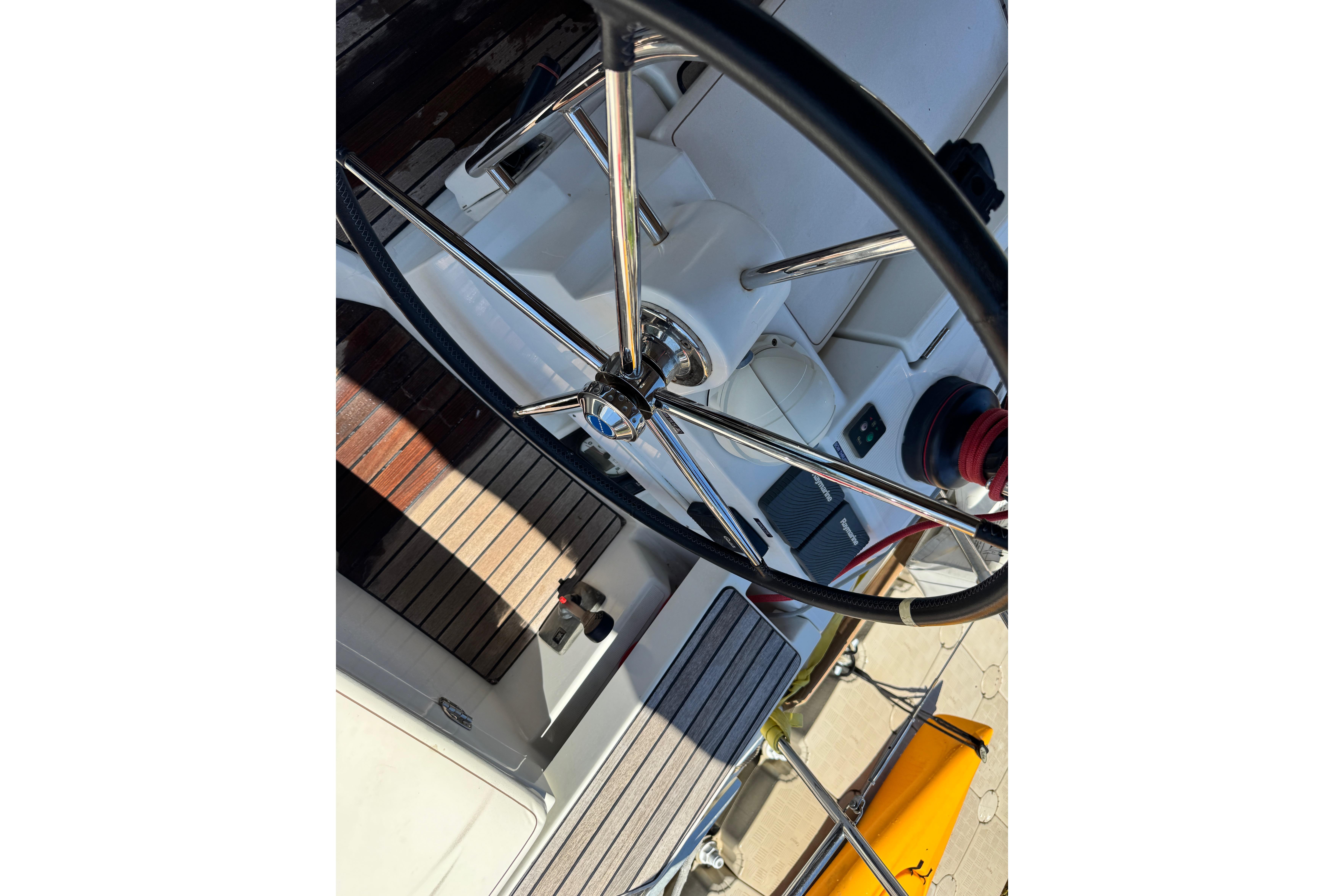 Steering wheel of 2020 Jeanneau Sun Odyssey 44 DS sailboat, showcasing cockpit details.