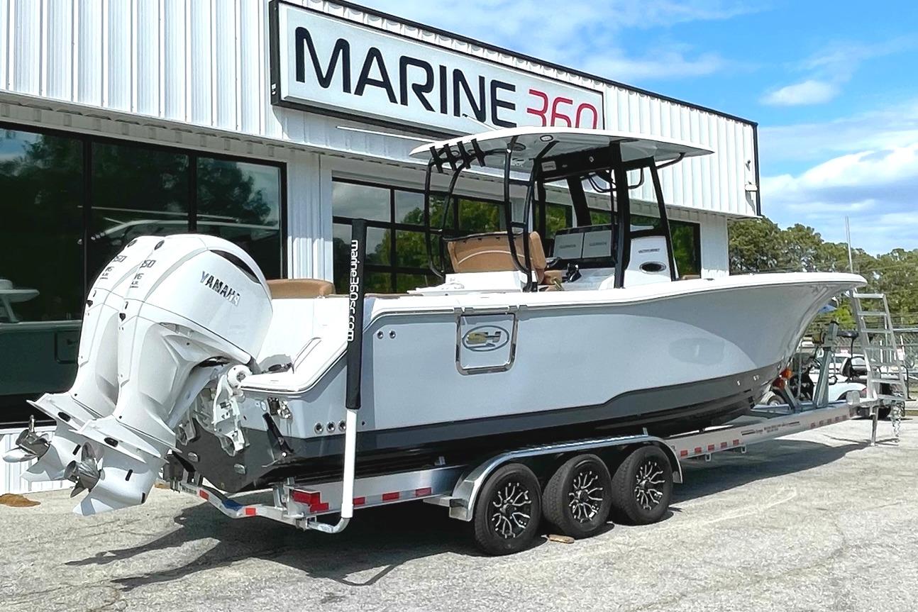 2026 Seahunt Ultra 305 CB boat on trailer at Marine 360 dealership.