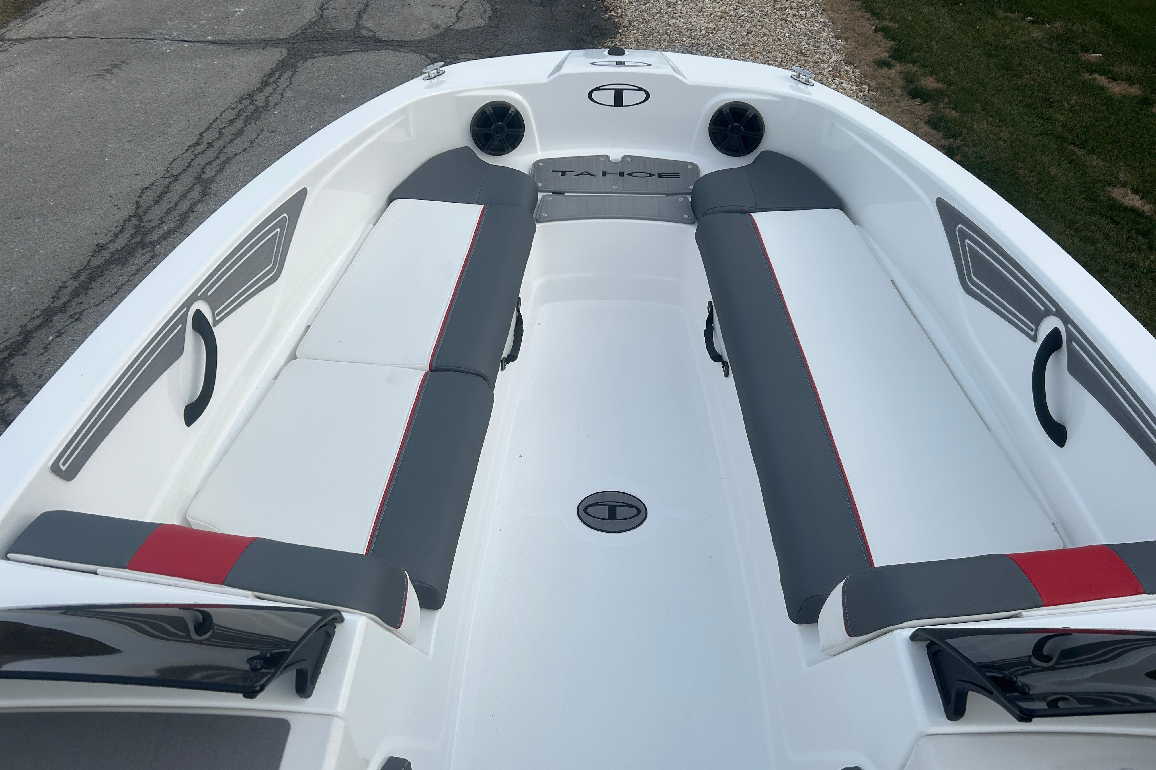 2025 Tahoe T21 boat interior with gray and red seating, sleek design.