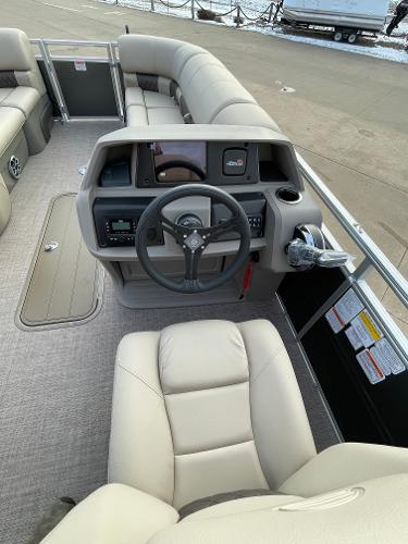 2024 Sun Tracker Party Barge 22 XP3 interior, featuring helm and seating area.