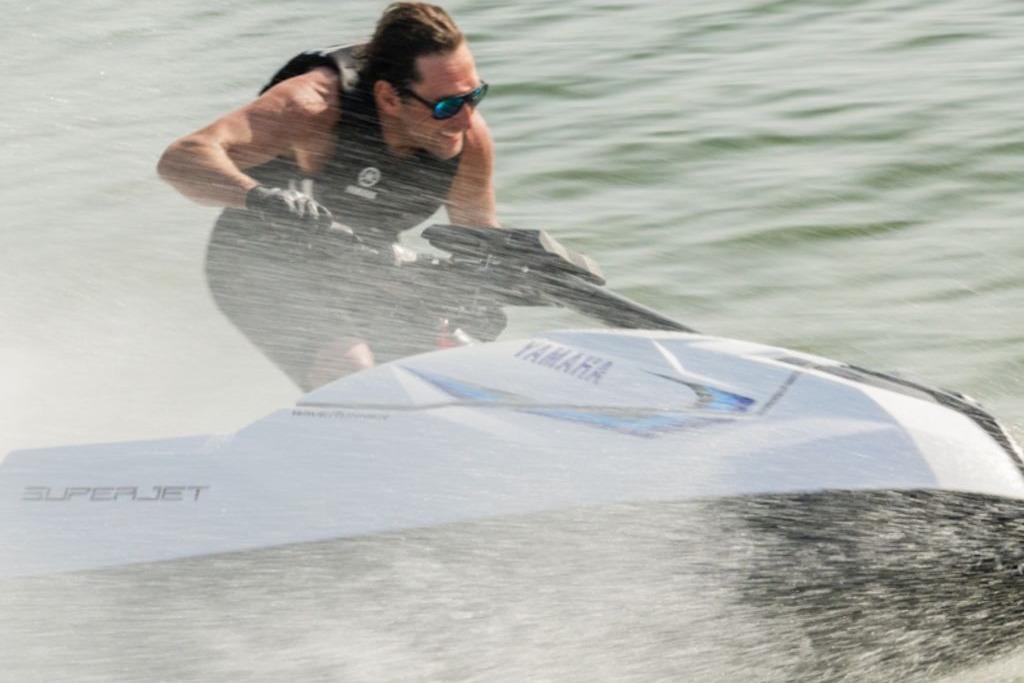 2025 Yamaha WaveRunner SuperJet speeding on water, rider in action.