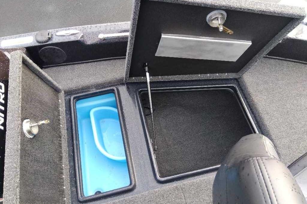 2025 Nitro ZV19 boat storage compartments with open lids and blue interior.