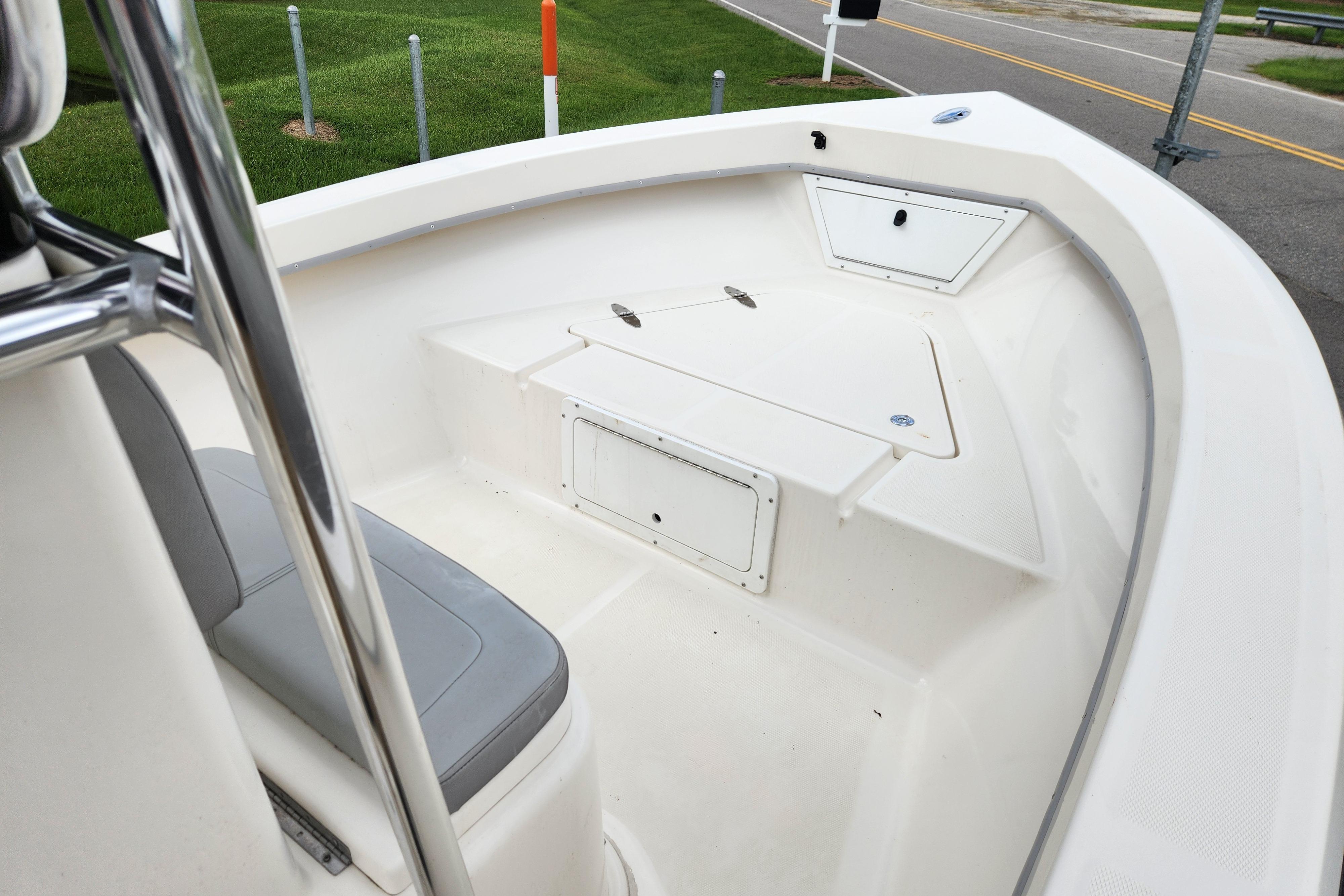 2023 May-Craft 1900CC boat interior with seating and storage compartments.