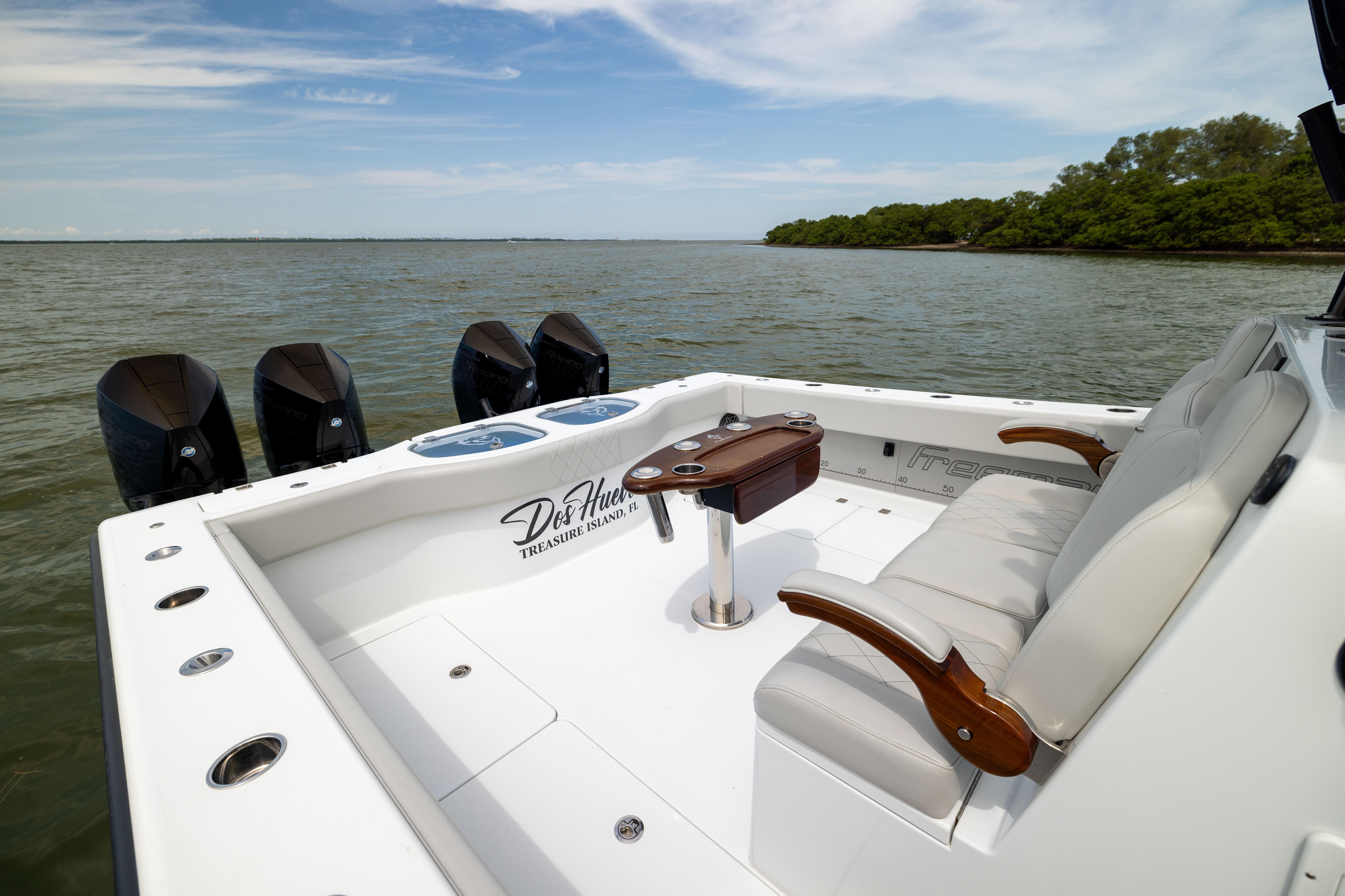 Luxury Freeman 42 LR boat interior, 2025 model, with plush seating and multiple outboard engines.