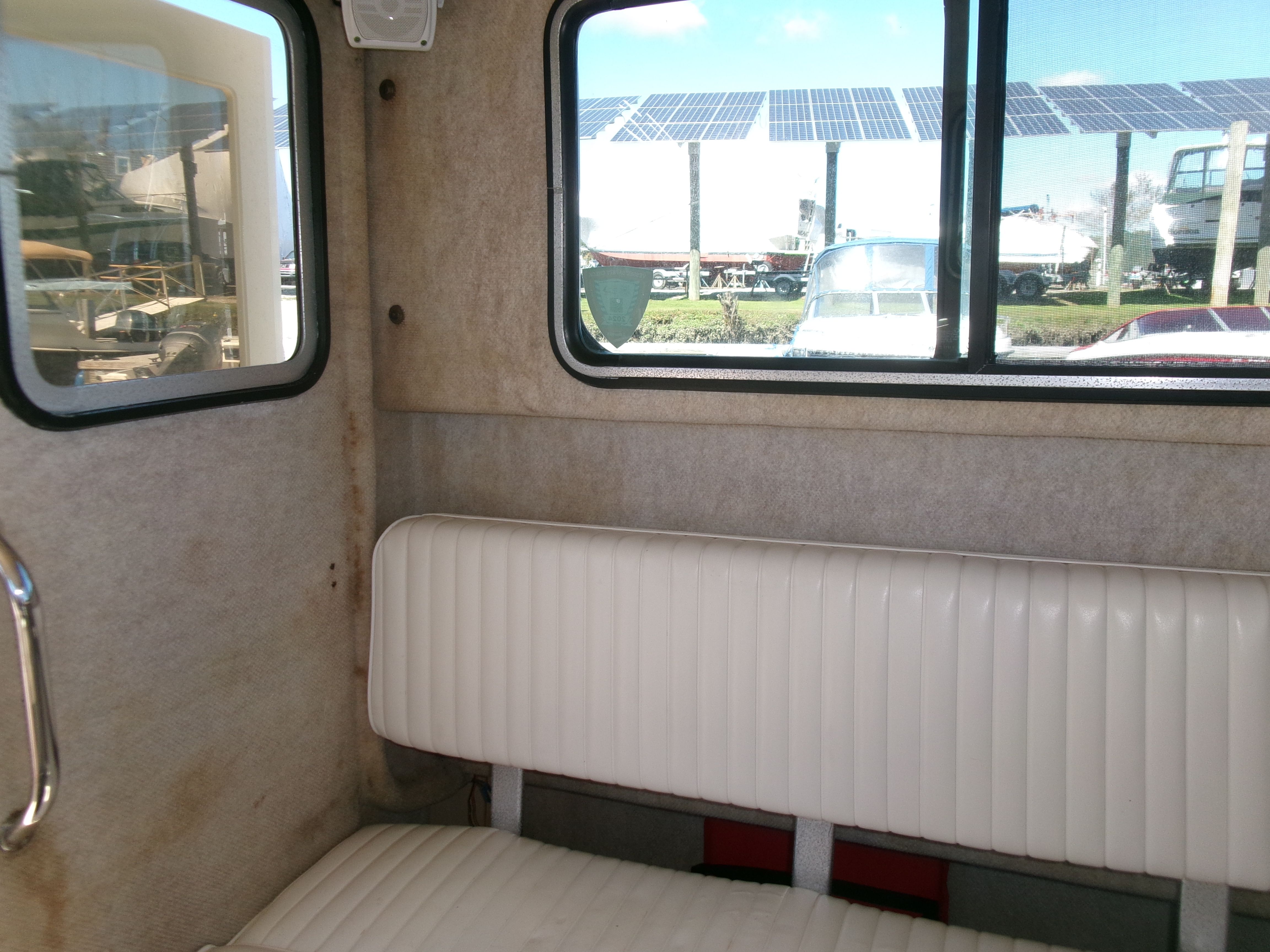 Interior of a 2007 Parker 2520 XL Sport Cabin with a white bench seat.