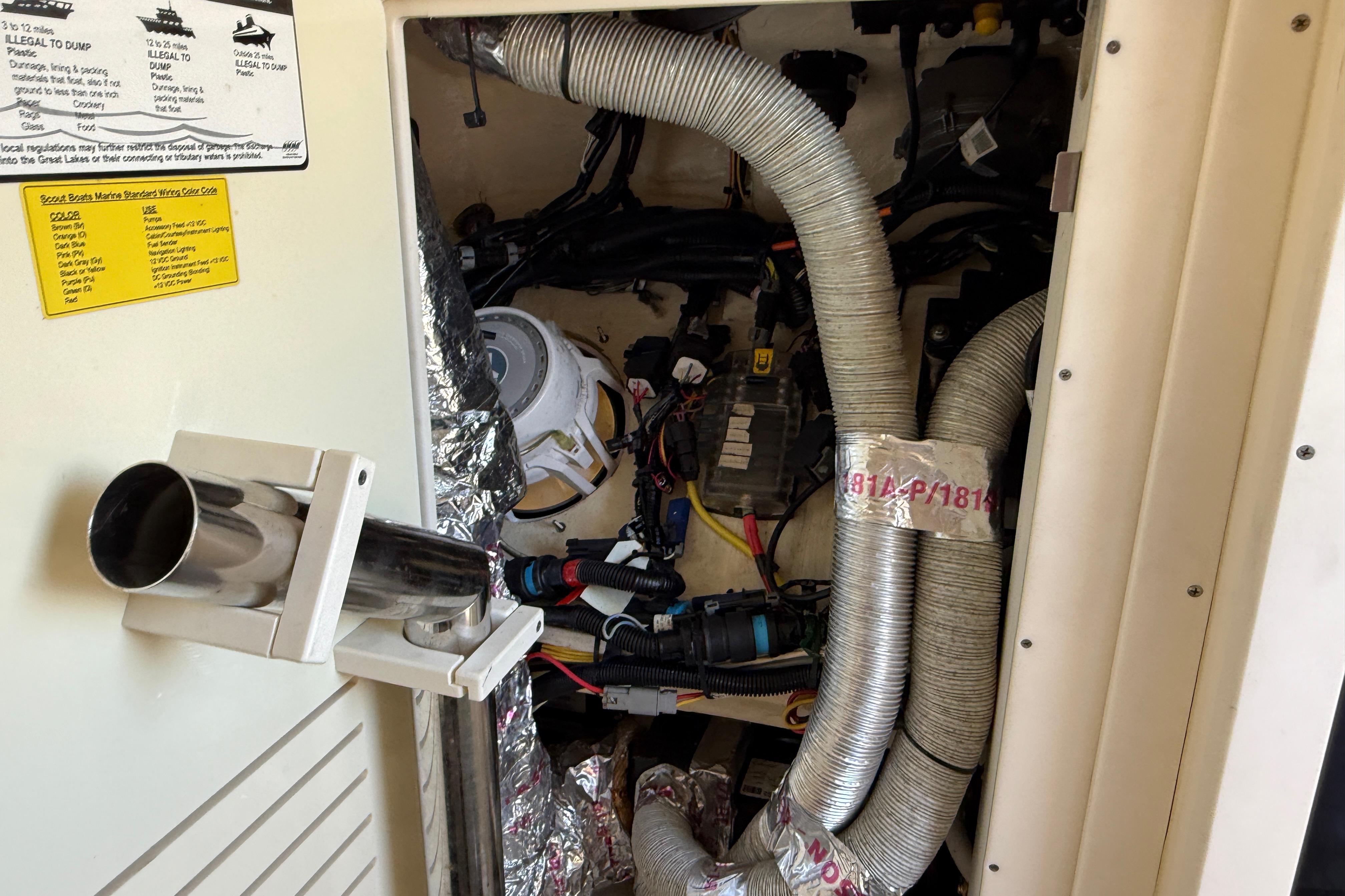 2019 Scout 355 LXF engine compartment with wiring and ventilation hoses.