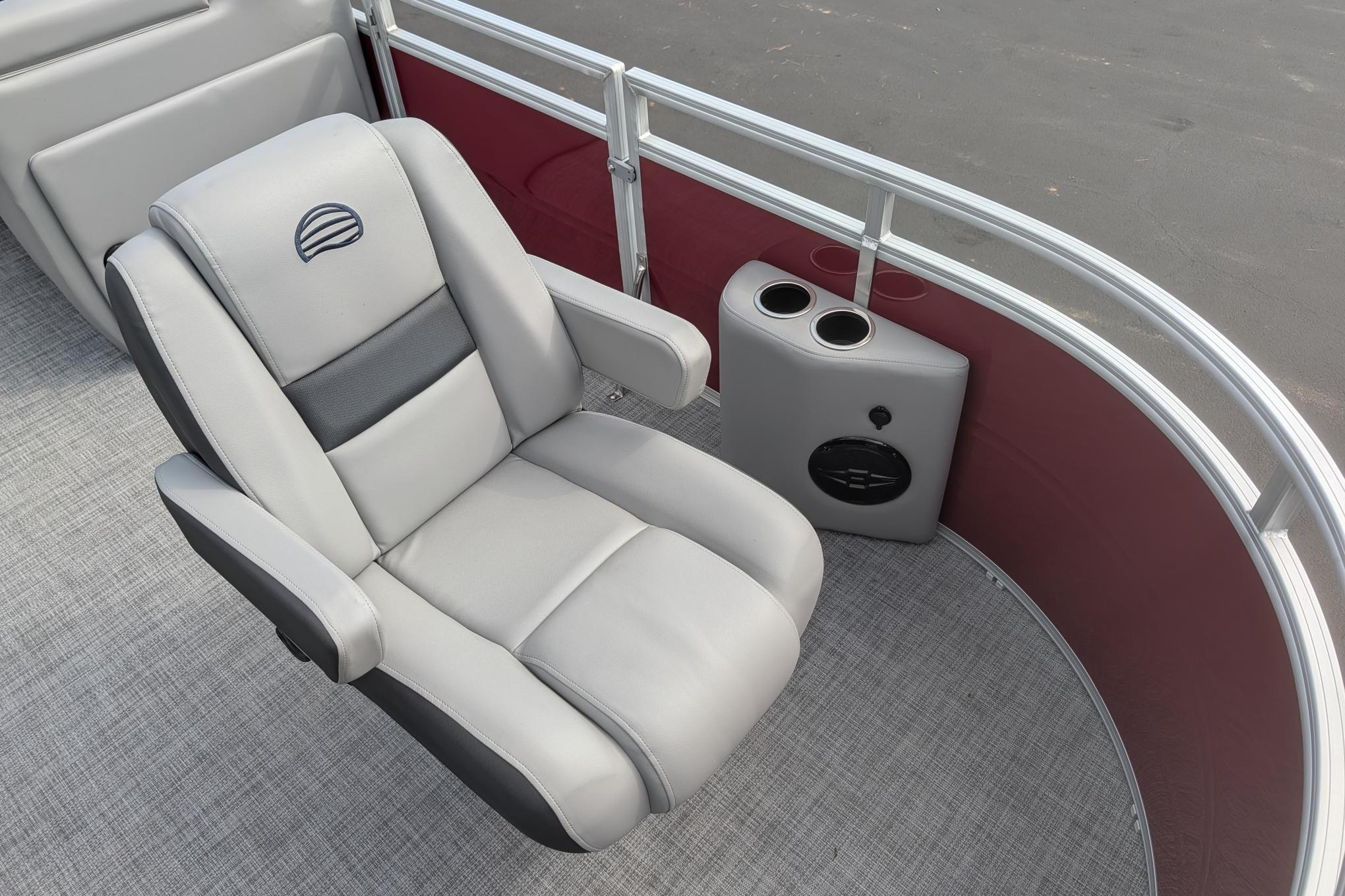 2026 Sun Tracker SportFish 20 DLX boat seat with cup holders and speaker.
