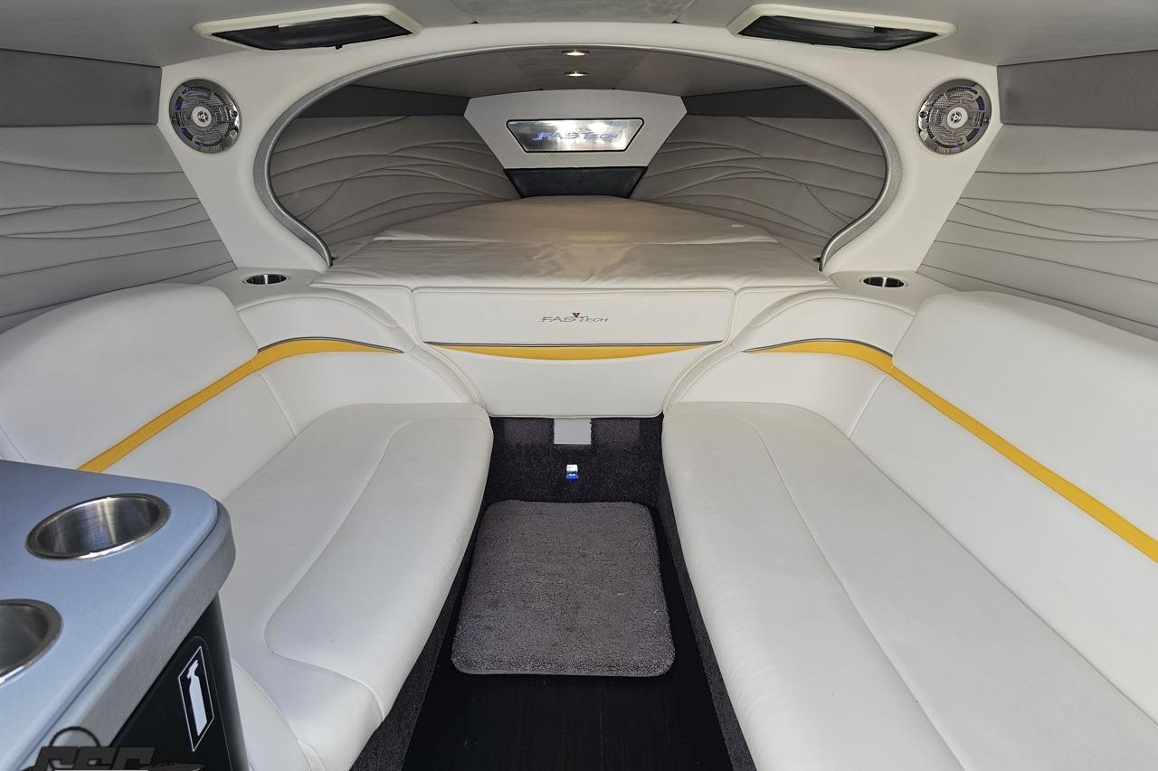 Luxurious interior of a 2014 Formula 292 FASTech boat with white seating and modern design.