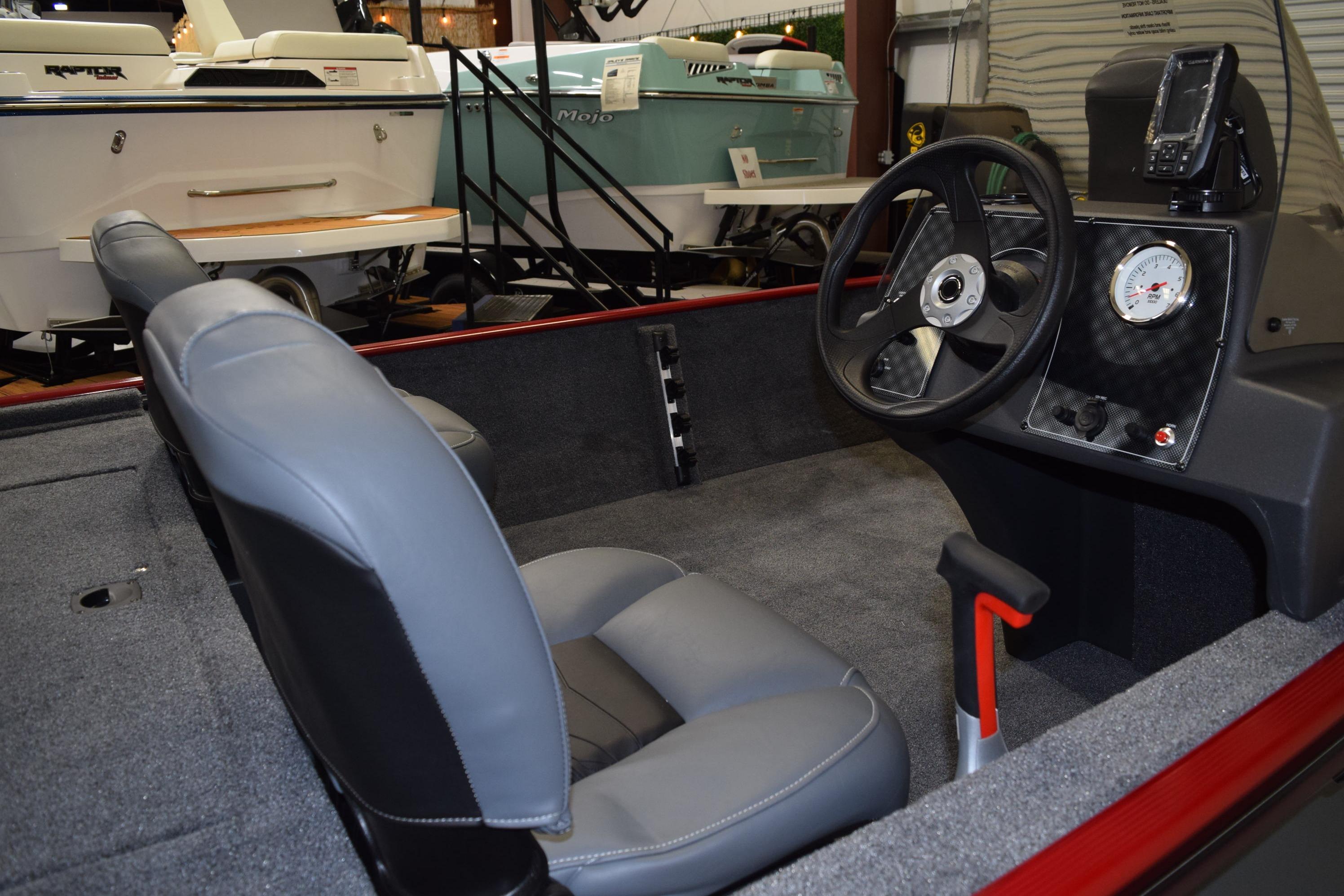 Interior of 2026 Tracker Bass Tracker Classic XL boat with steering wheel and seating.