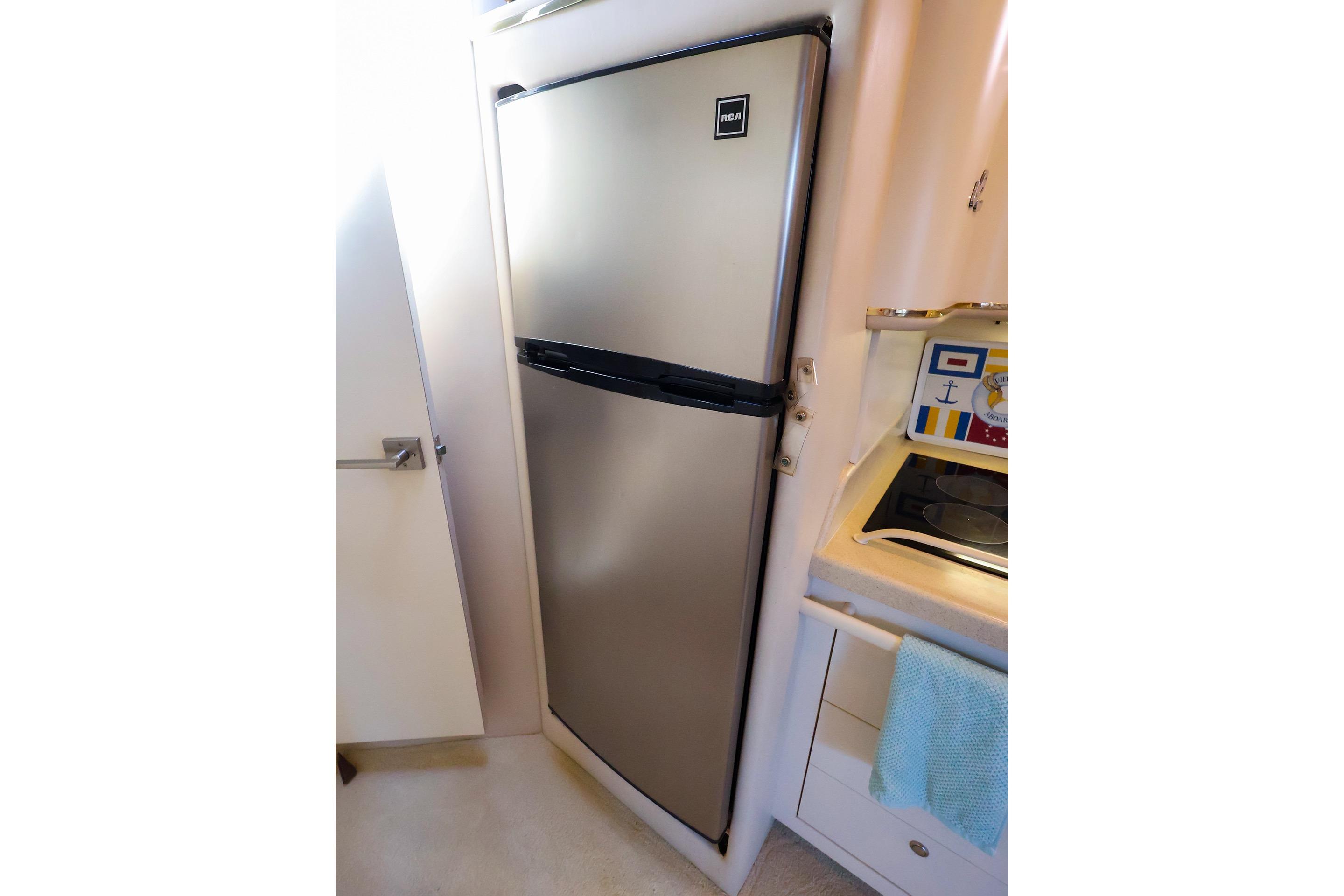 Stainless steel refrigerator in 1998 Sea Ray 500 Sundancer yacht kitchen.