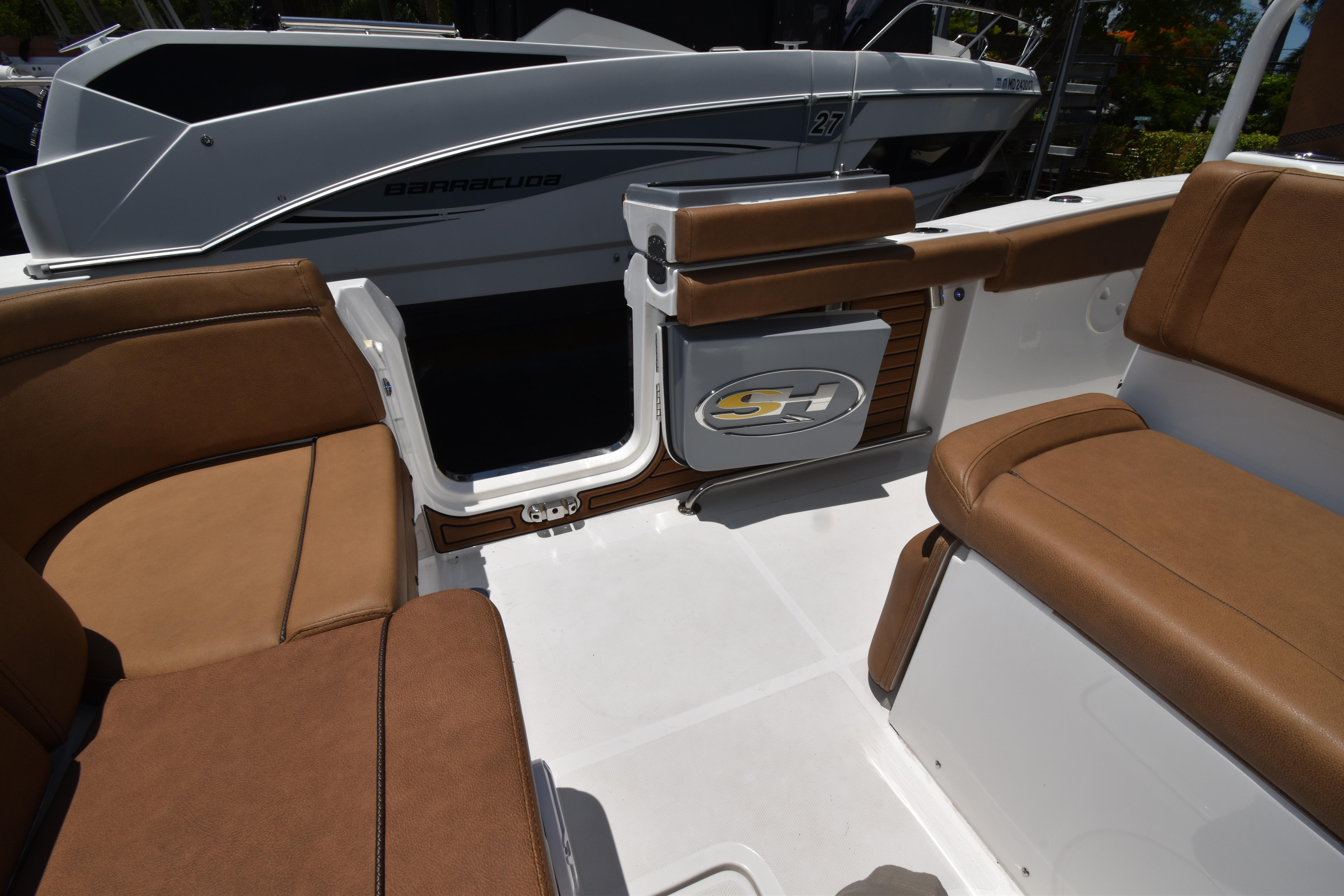 2020 Sea Hunt Ultra 275 SE boat interior with brown seating and sleek design.