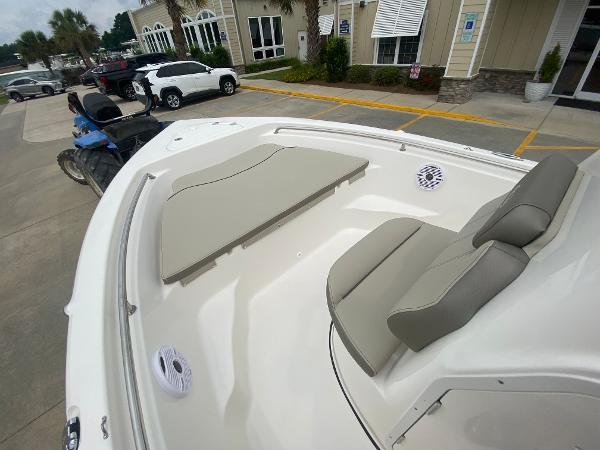 2024 Key West 189 FS boat interior with cushioned seating and speakers.