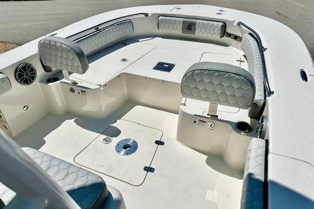 2026 Carolina Skiff 24 Ultra Elite boat interior with cushioned seating and storage compartments.