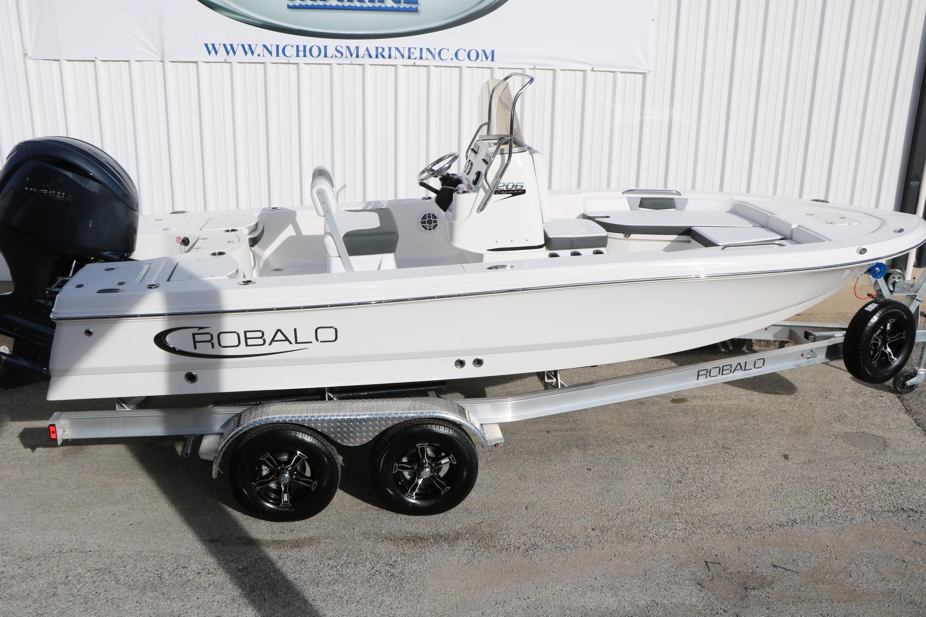 2026 Robalo 206 Cayman boat on trailer, displayed outdoors.