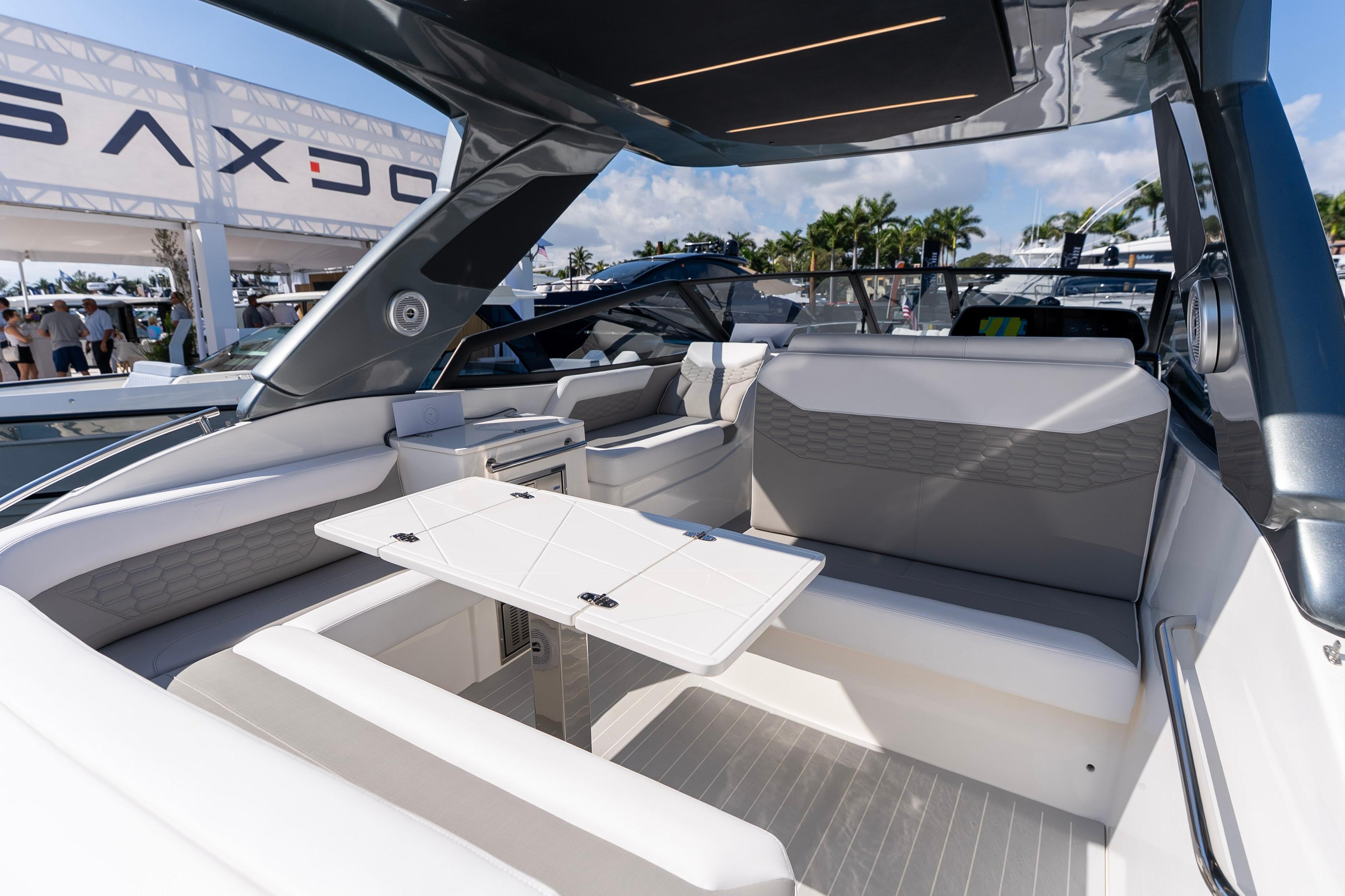 Luxurious interior of 2026 Valiatt 350GT boat with modern seating and table.