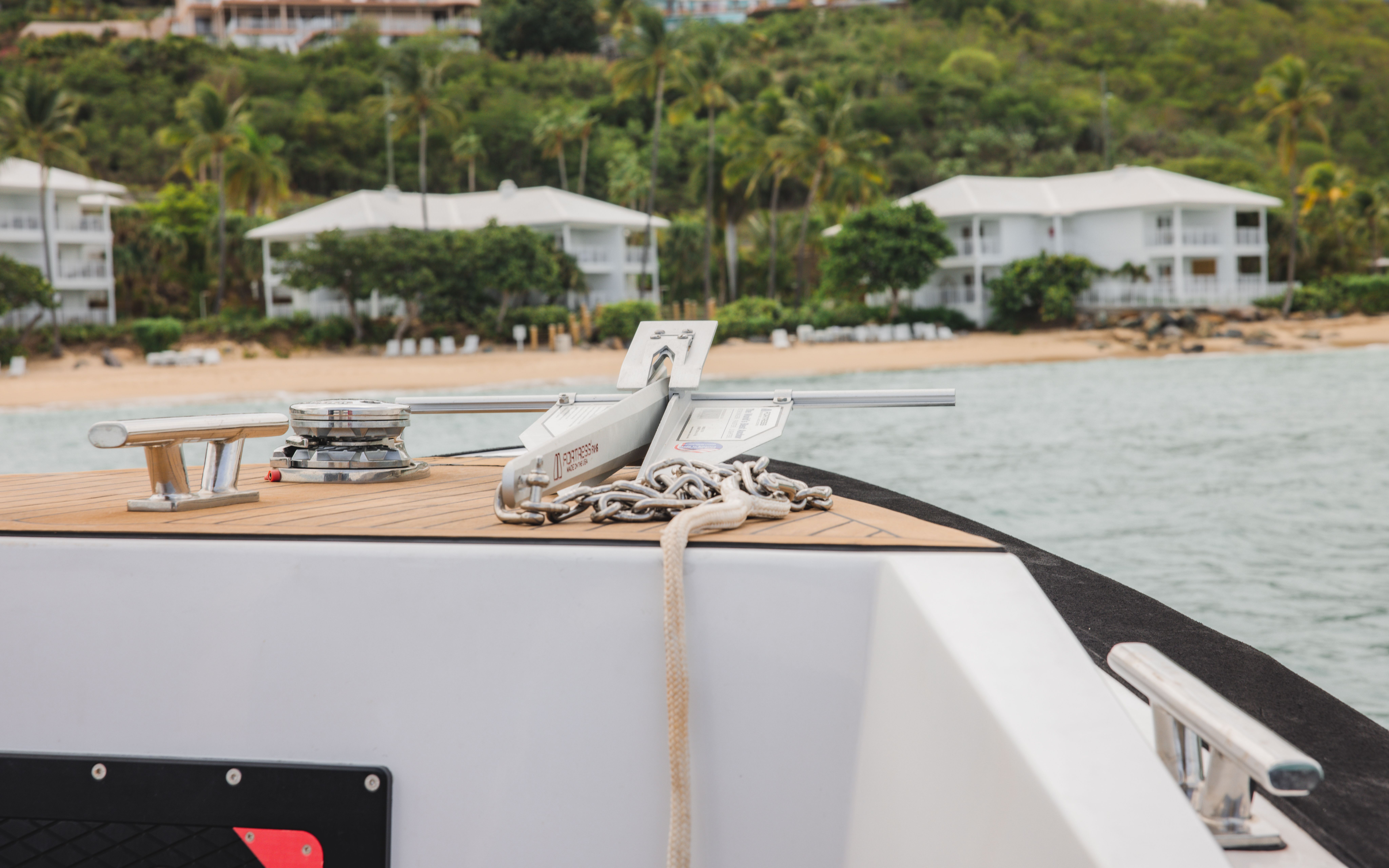 2021 Ultimate O-Class yacht anchored near tropical beach.
