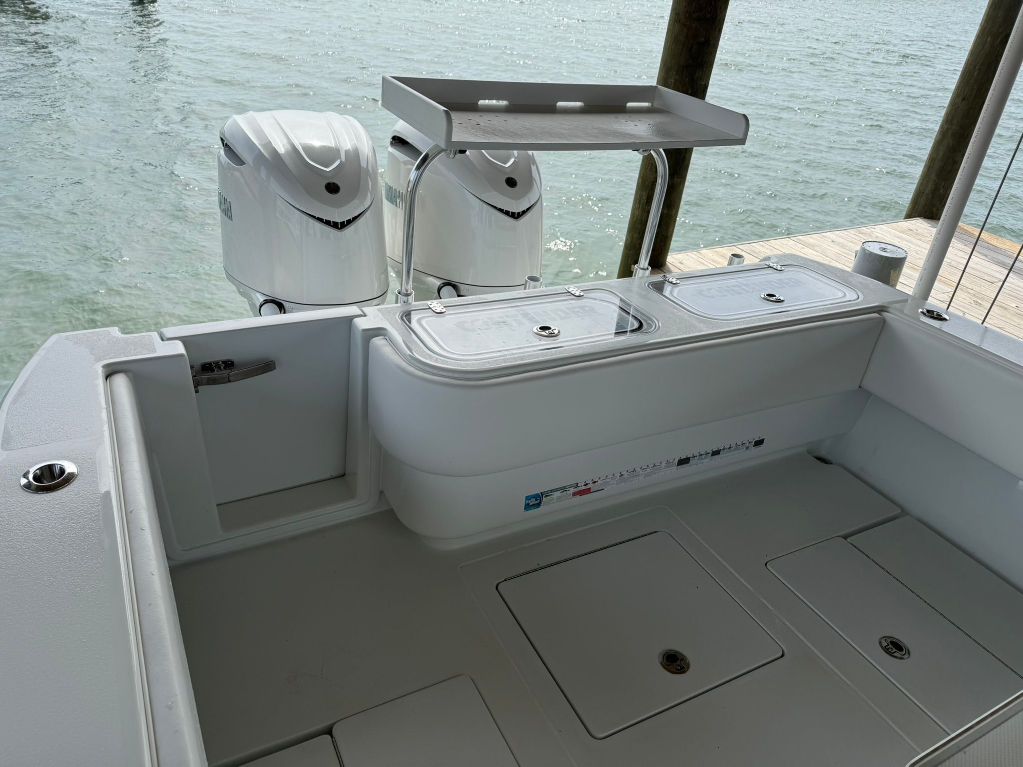 Contender 32 ST 2025 with dual outboard engines at the dock.