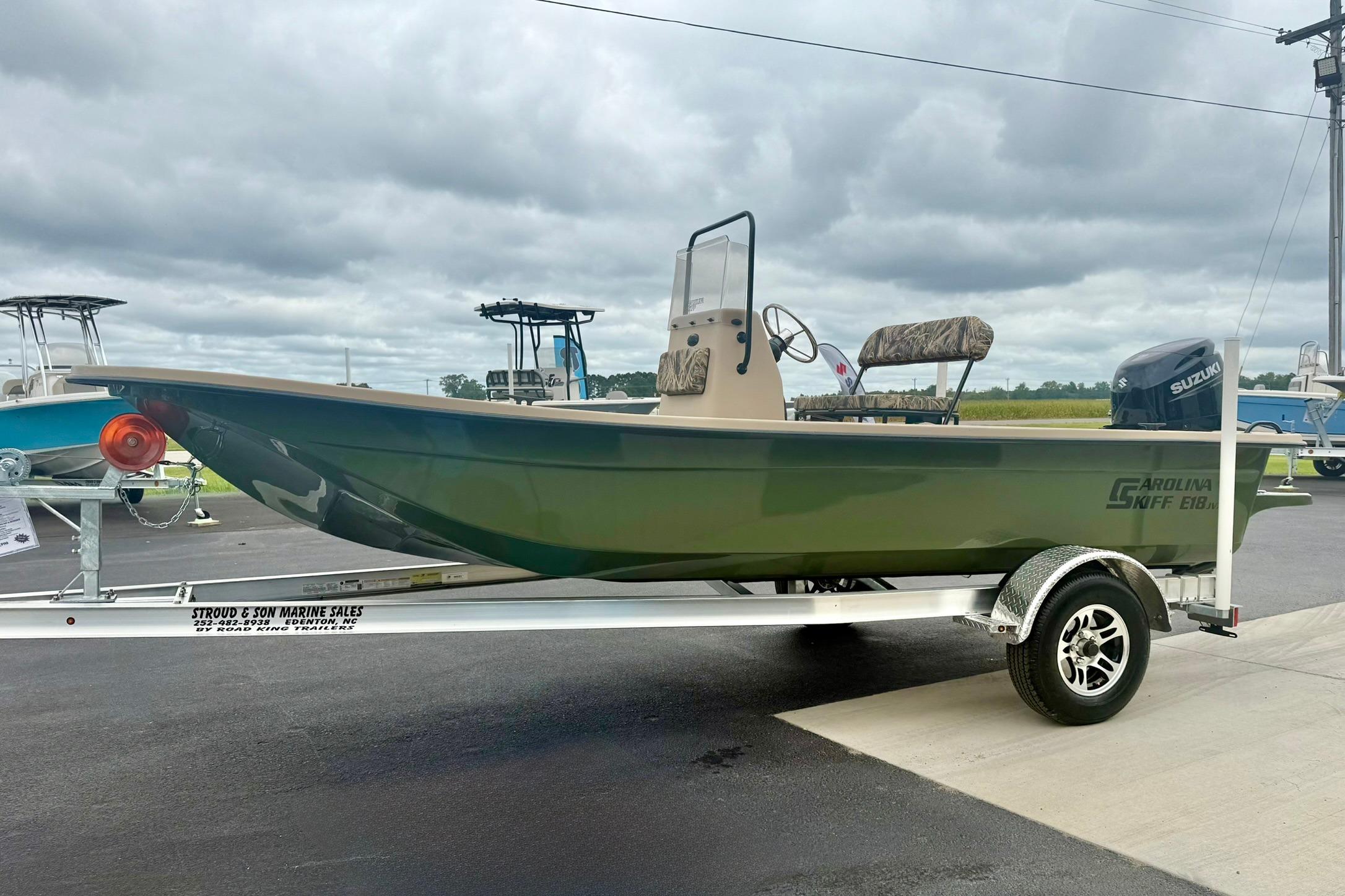 2026 Carolina Skiff E18 JVX CC boat on trailer, outdoor display.