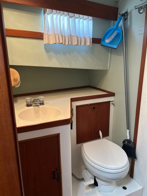 Bathroom of a 1980 Grand Banks 32 Sedan yacht.