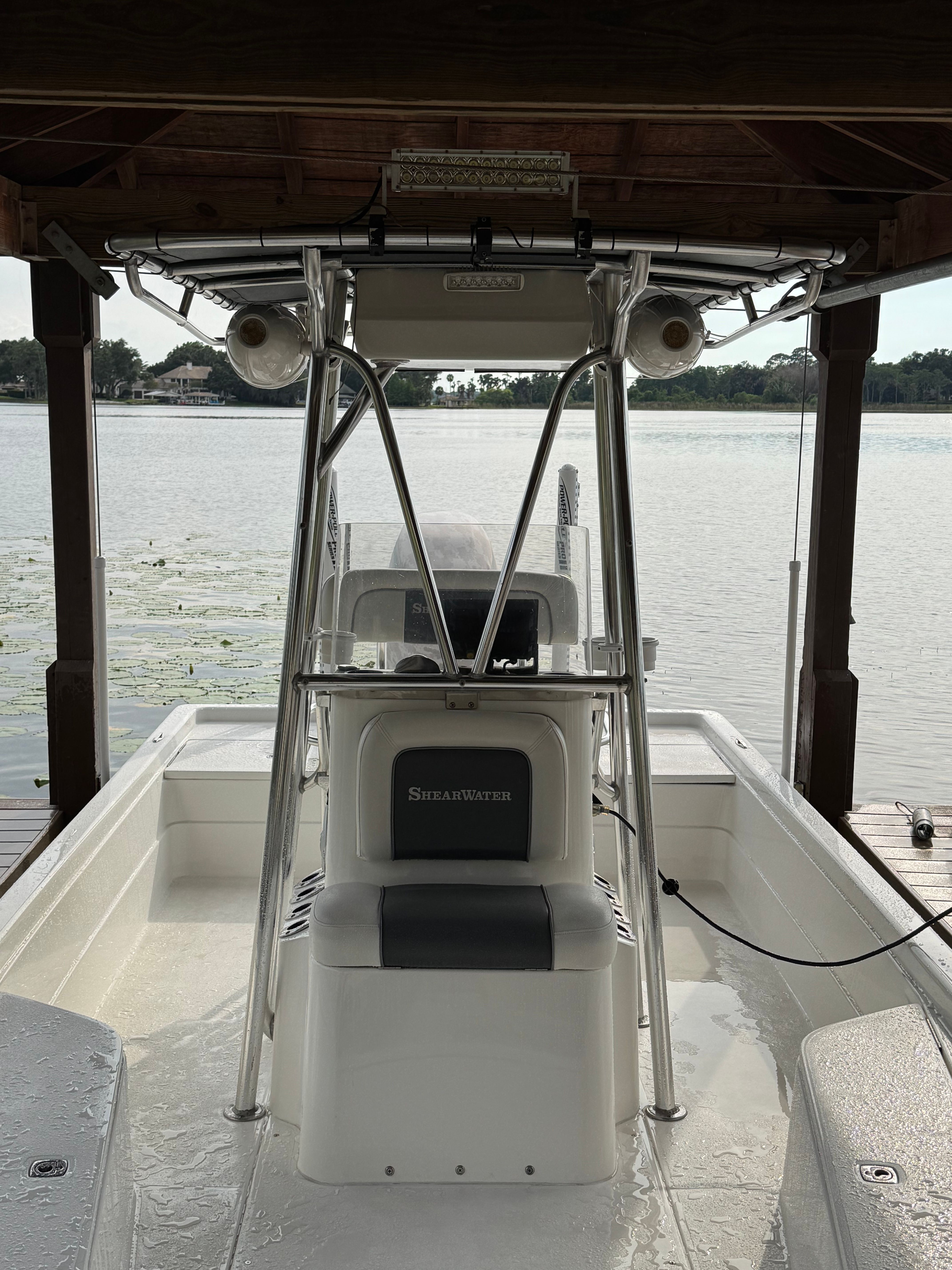 2004 ShearWater LTZ boat docked with lake view.