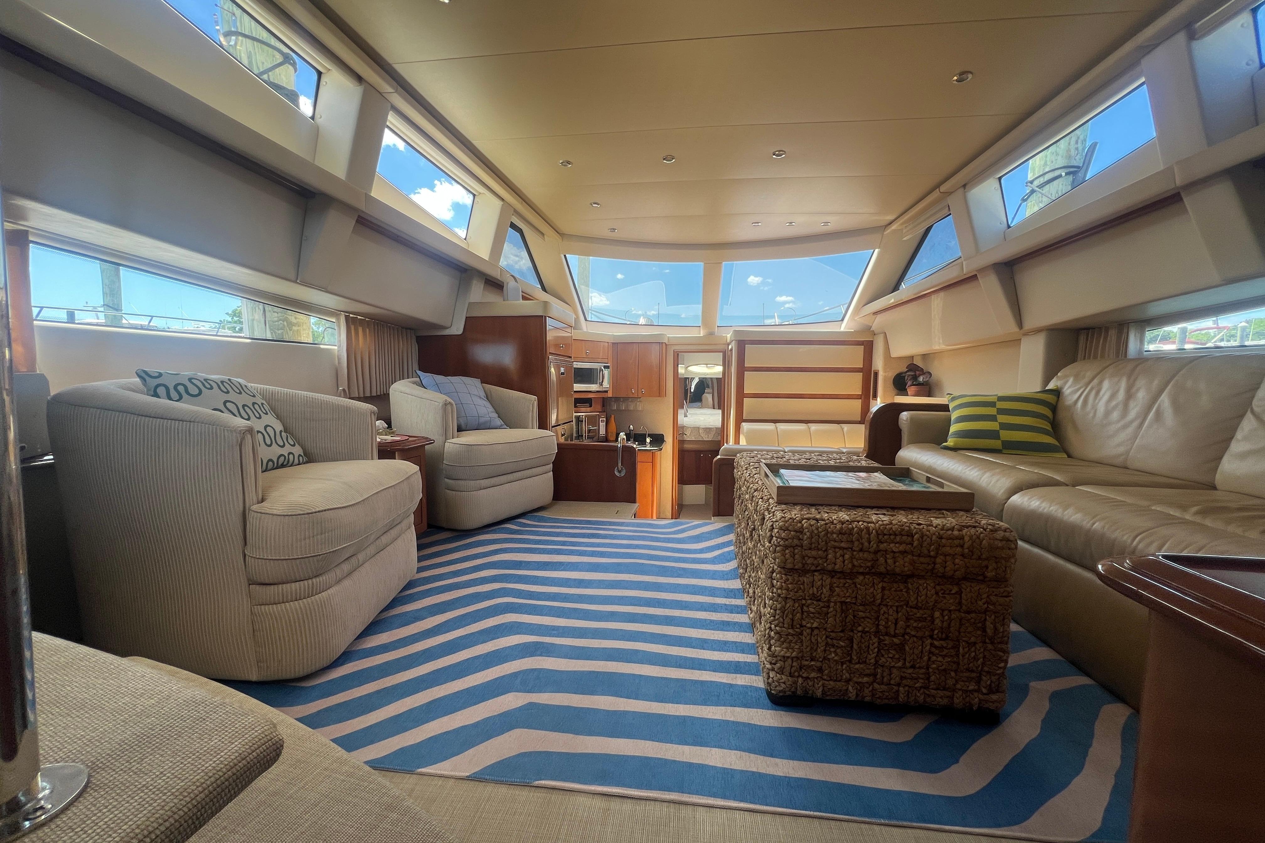 Luxurious interior of a 2006 Carver 43 Motor Yacht with modern furnishings and ample natural light.