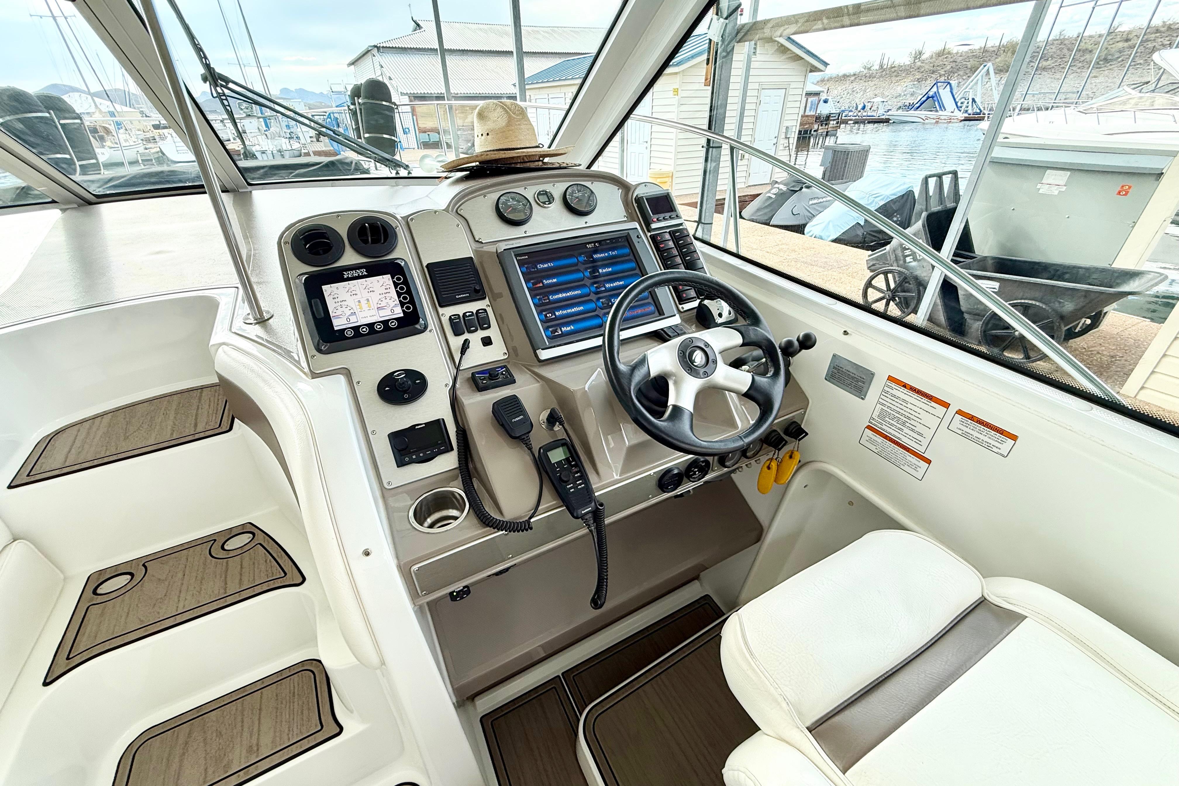 2011 Cruisers Yachts 390 Sports Coupe helm with modern controls and navigation equipment.