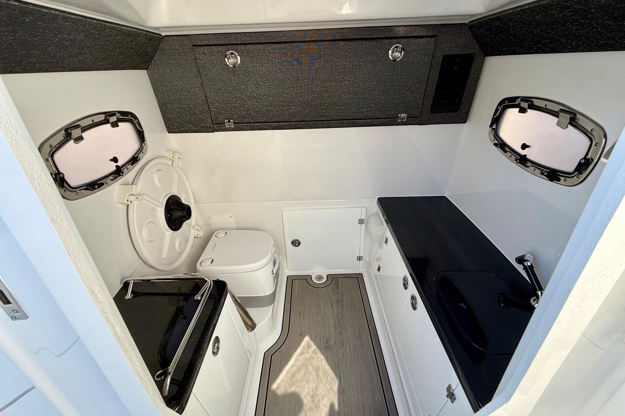 Interior of 2026 Monterey Elite 27 OB with toilet and sink.
