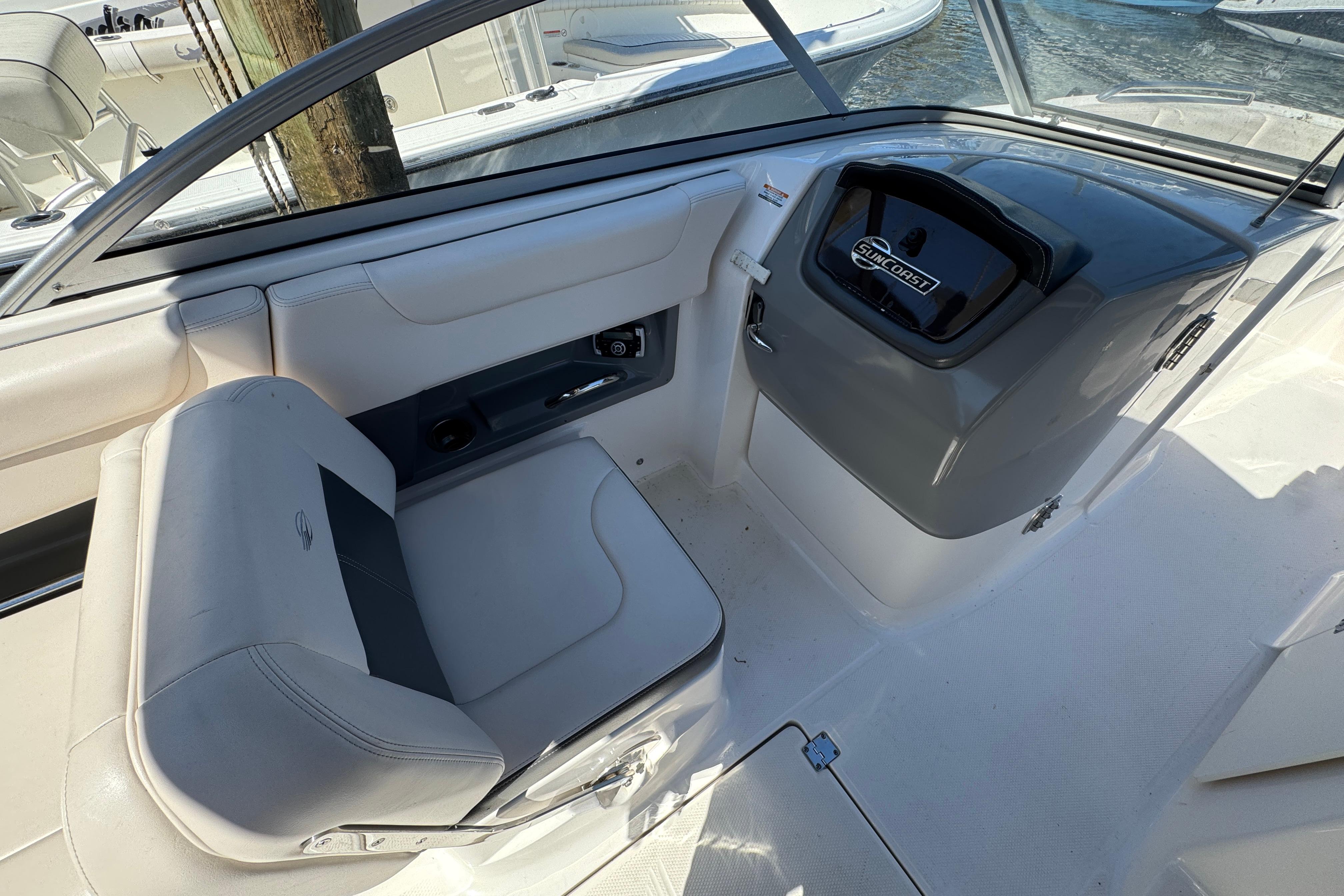 2018 Chaparral 250 Suncoast boat interior with helm and seating area.