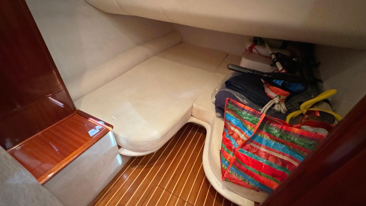 Interior cabin of 2004 Windy 34 Khamsin boat with storage and seating area.