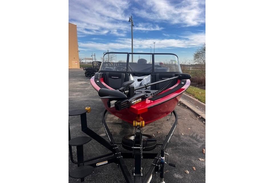 2026 Tracker Targa V-18 WT boat on trailer, parked outdoors under blue sky.