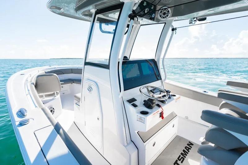 2026 Sportsman Open 282 Center Console boat on clear blue water.
