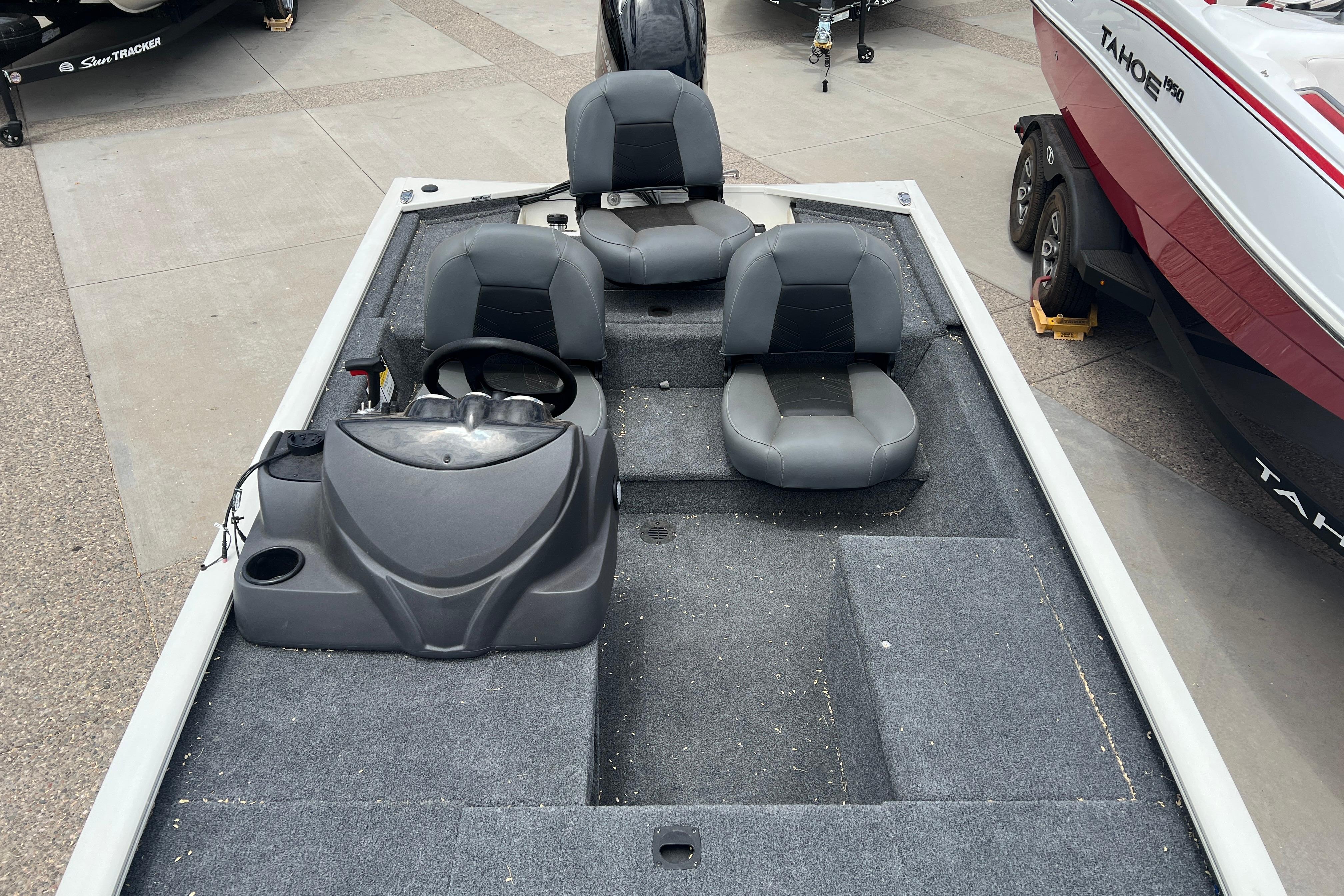 2026 Tracker Pro 170 boat interior with gray seating and steering console.
