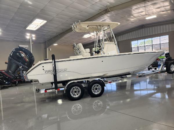 2025 Pathfinder 2400 Open boat on trailer in showroom.