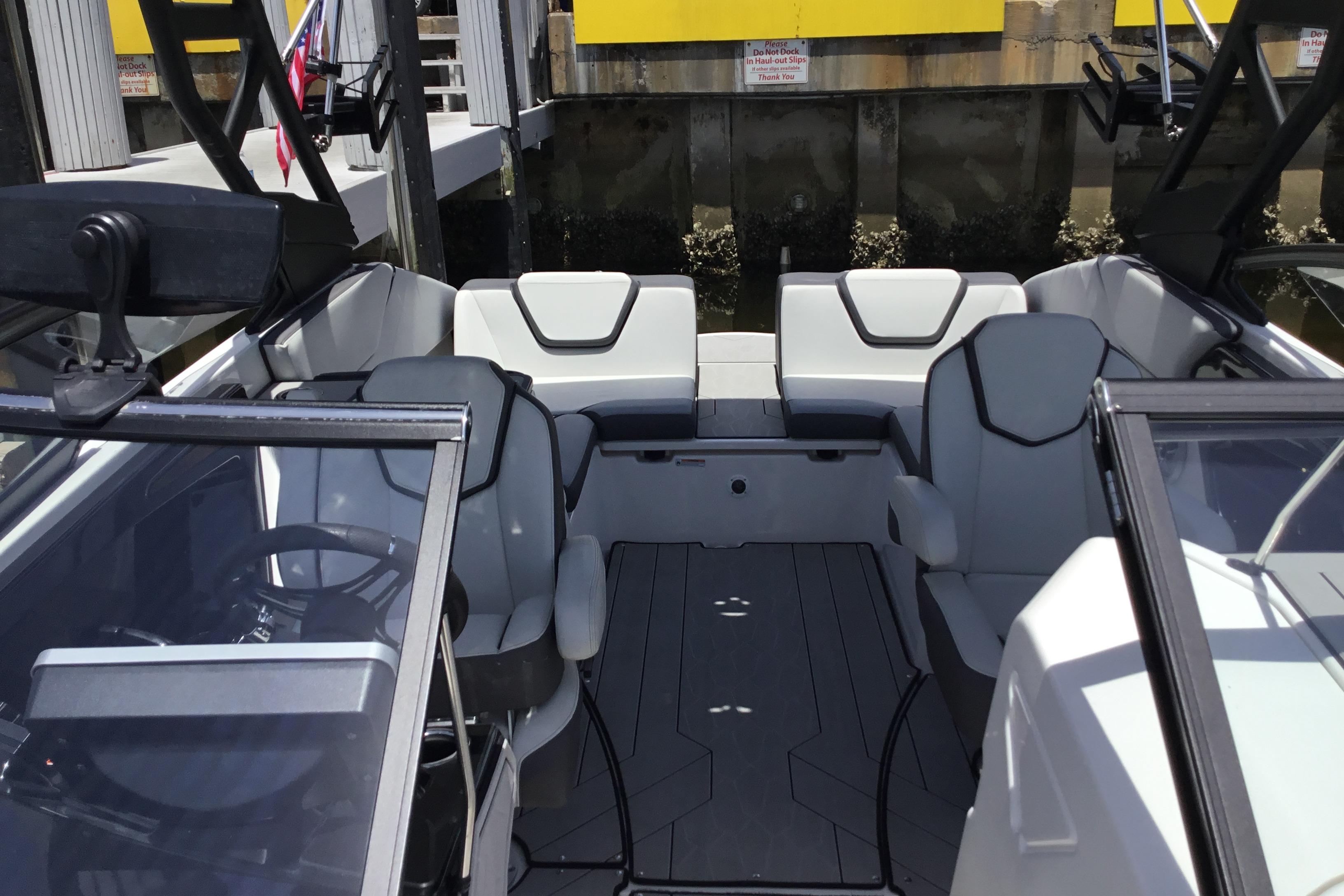 2023 Yamaha Boats 252XE interior with sleek seating and modern design.