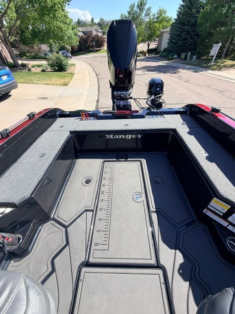 The image shows the deck of a 2024 Ranger 621FS Pro boat on a street.