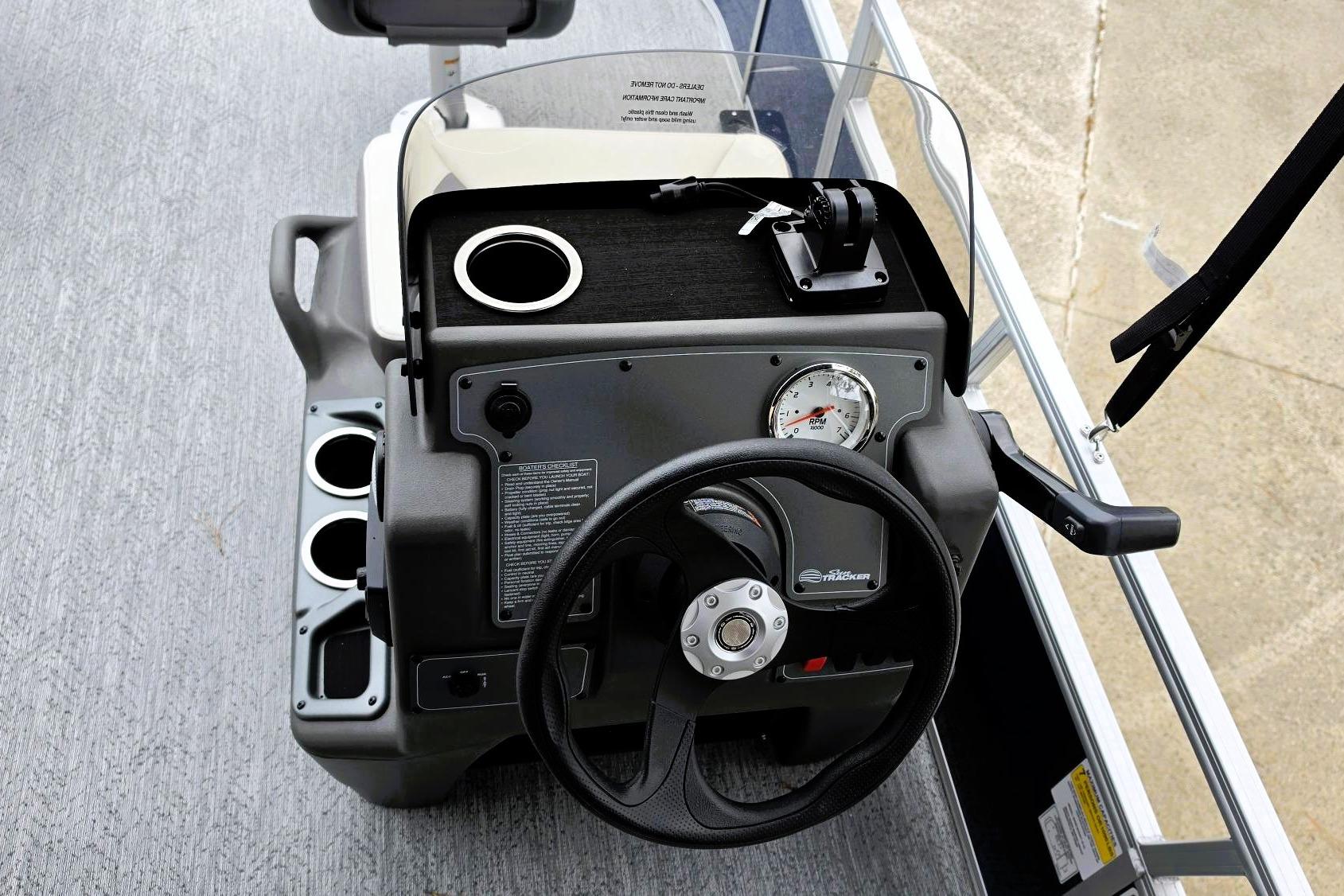 2026 Sun Tracker Bass Buggy 16 XL Select dashboard with steering wheel and cup holders.