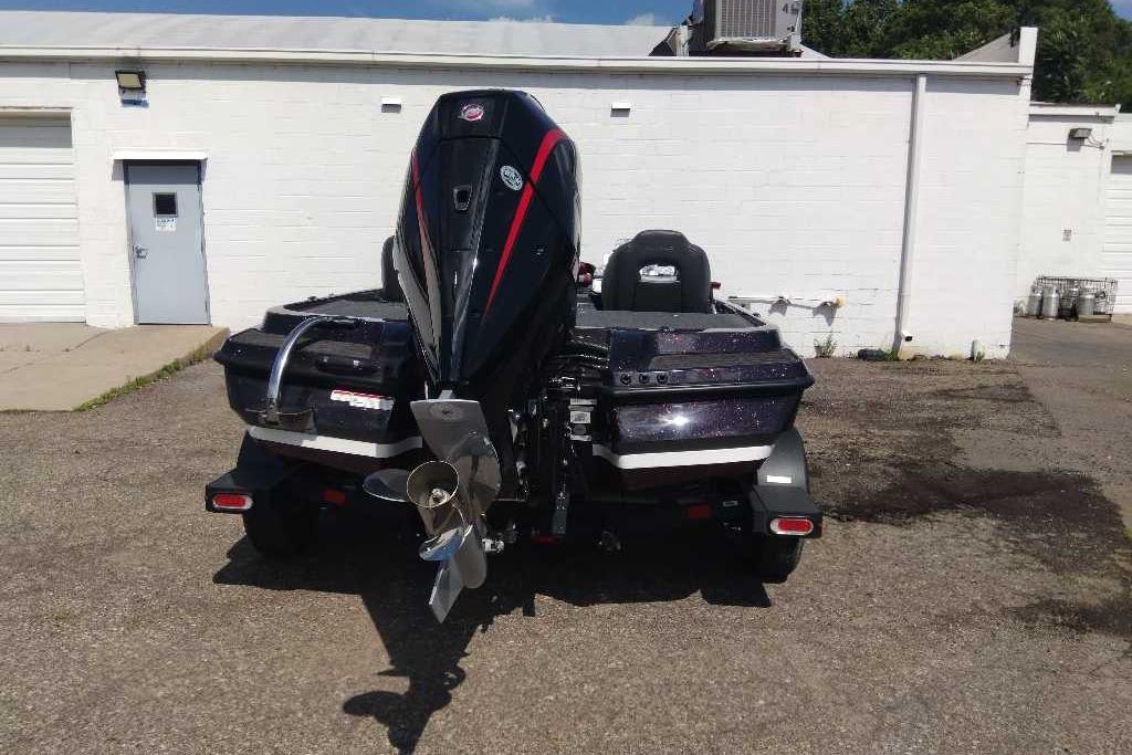 2026 Nitro Z20 XL Pro boat, rear view, parked outside a white building.
