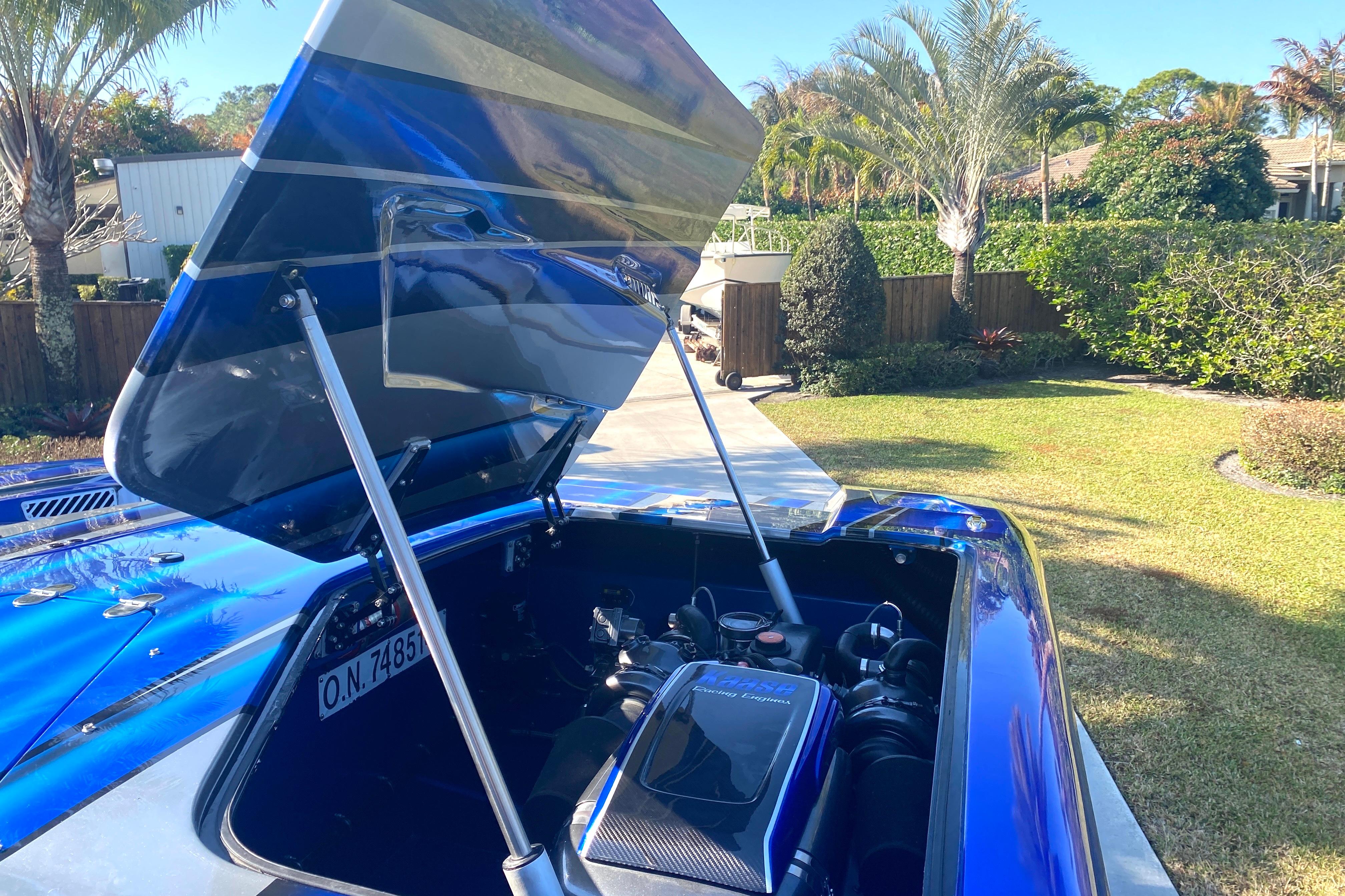 Open engine compartment of a 2016 MTI 44 RP boat, showcasing its powerful engine.