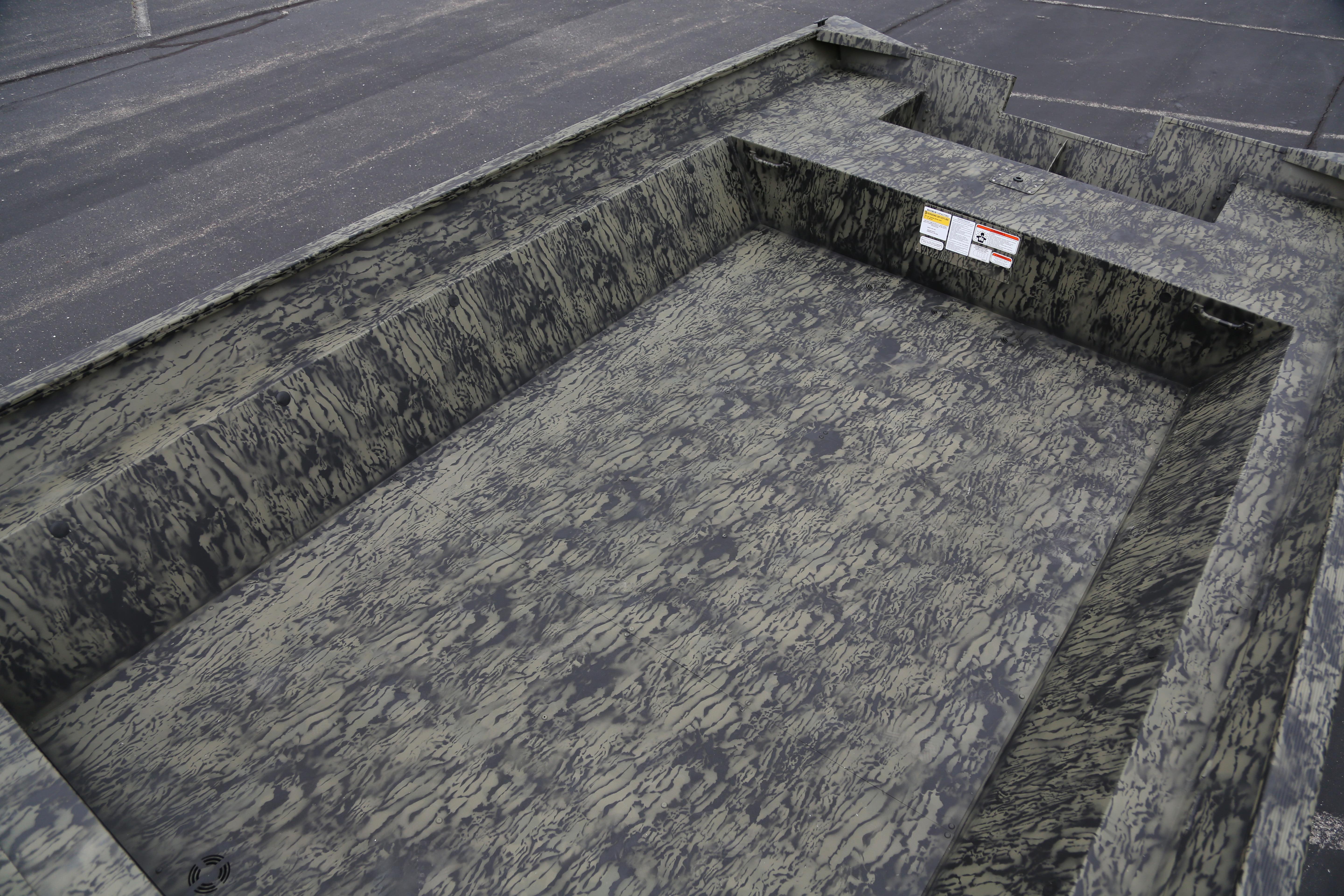 2026 Tracker GRIZZLY 2072 Utility boat interior with camouflage pattern.