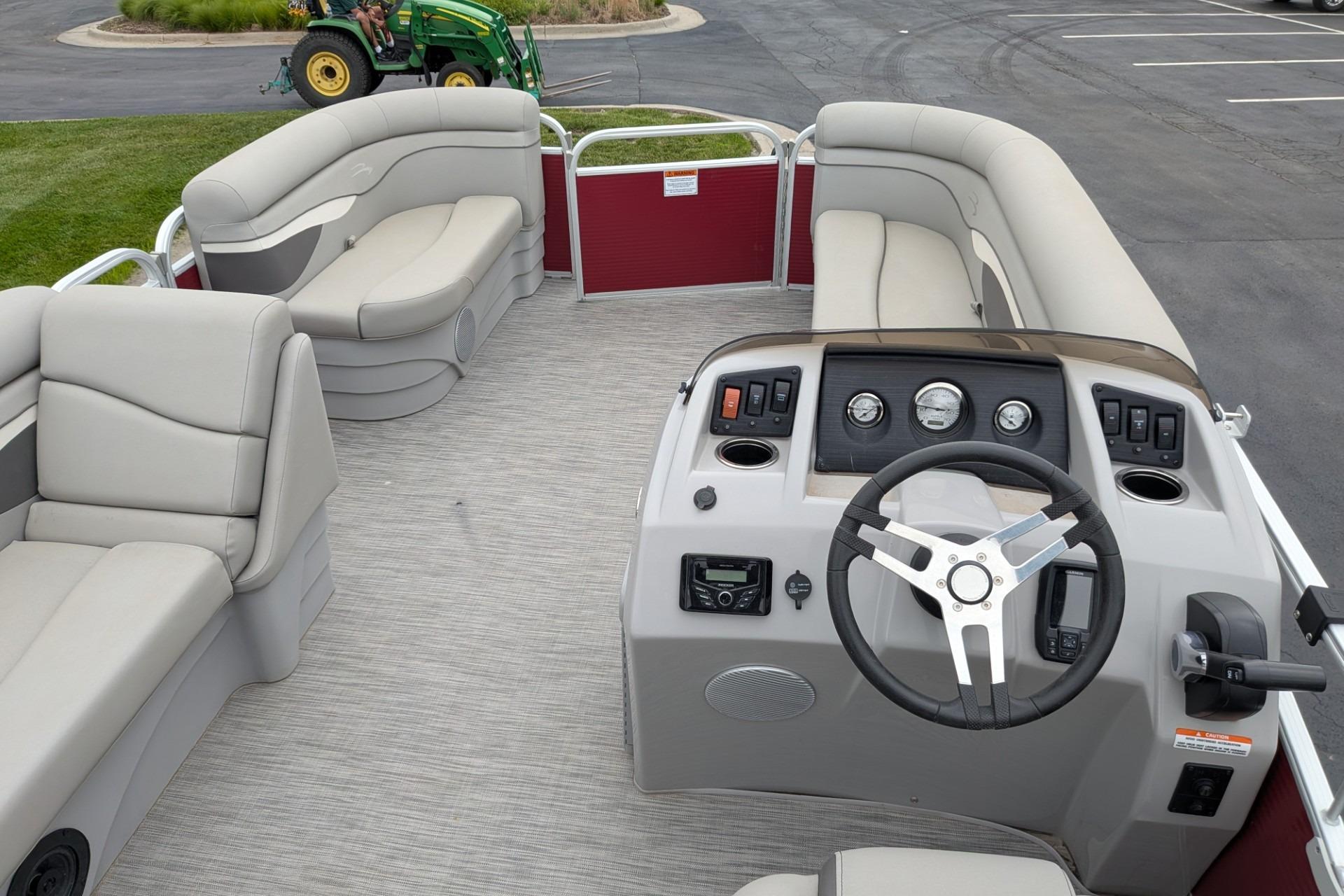 2021 Bennington 205SL pontoon boat interior with steering console and seating.