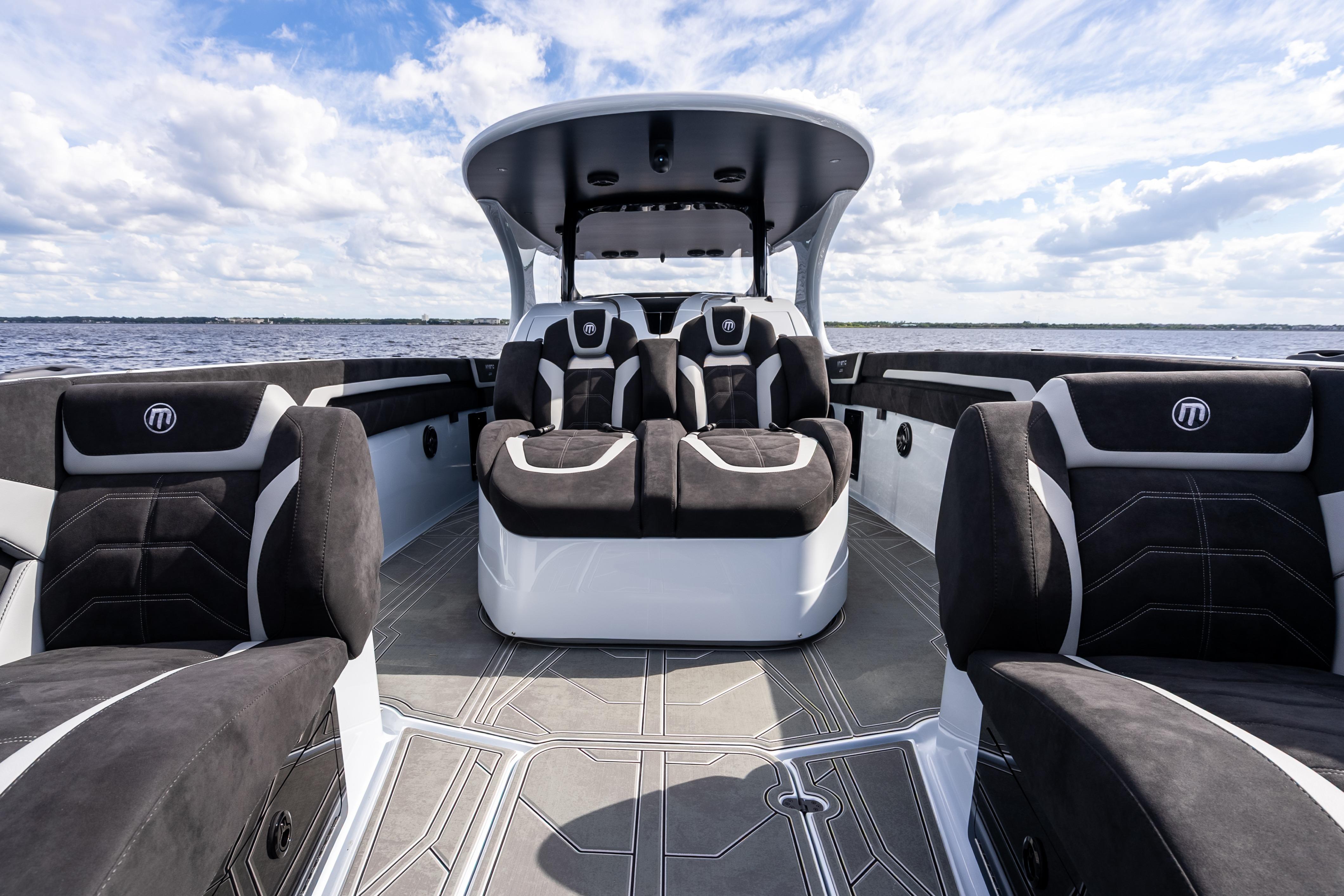 2027 Mystic Powerboats M4200 interior with luxurious seating on open water.