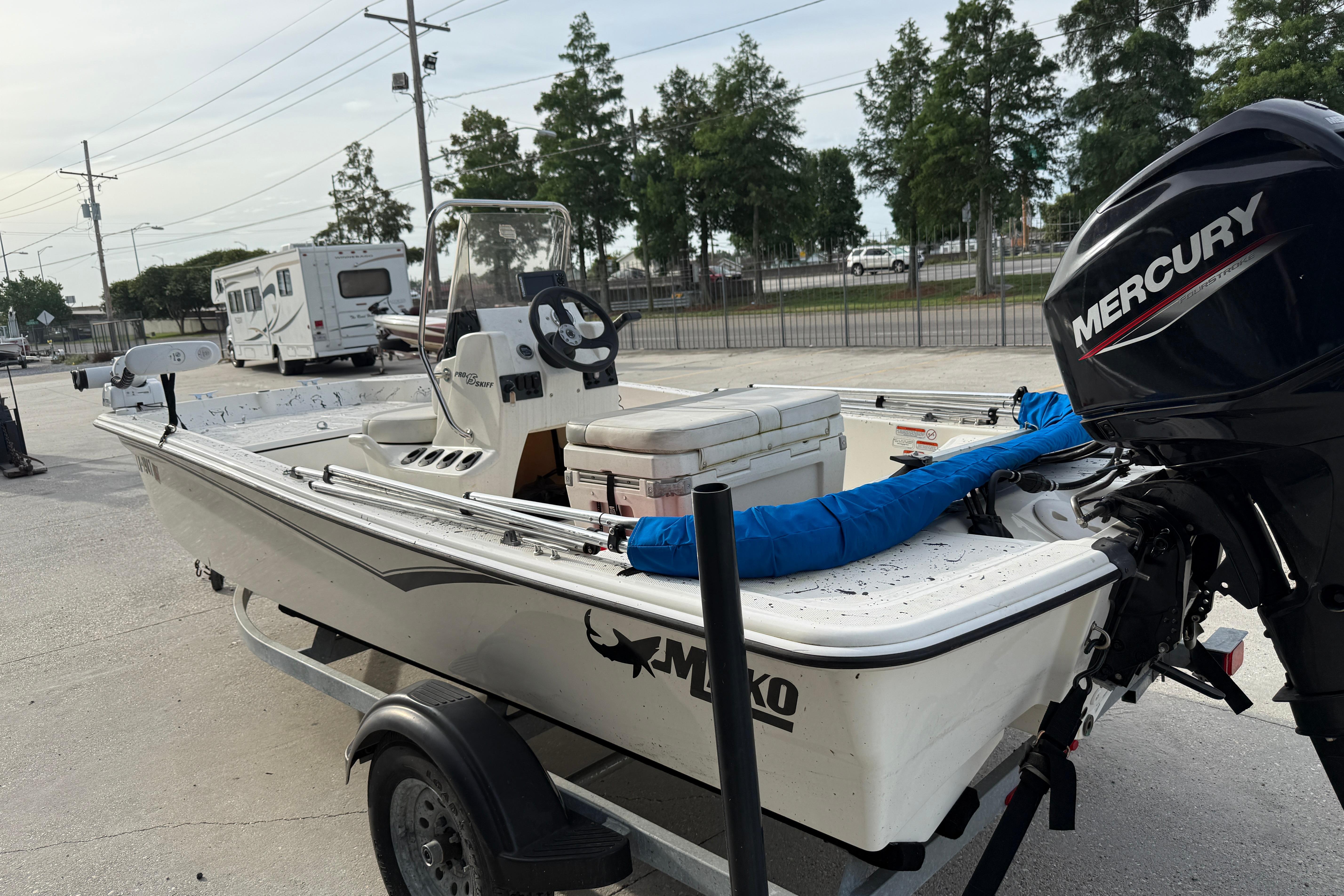 2020 Mako Pro Skiff 15 CC boat with Mercury engine on trailer.
