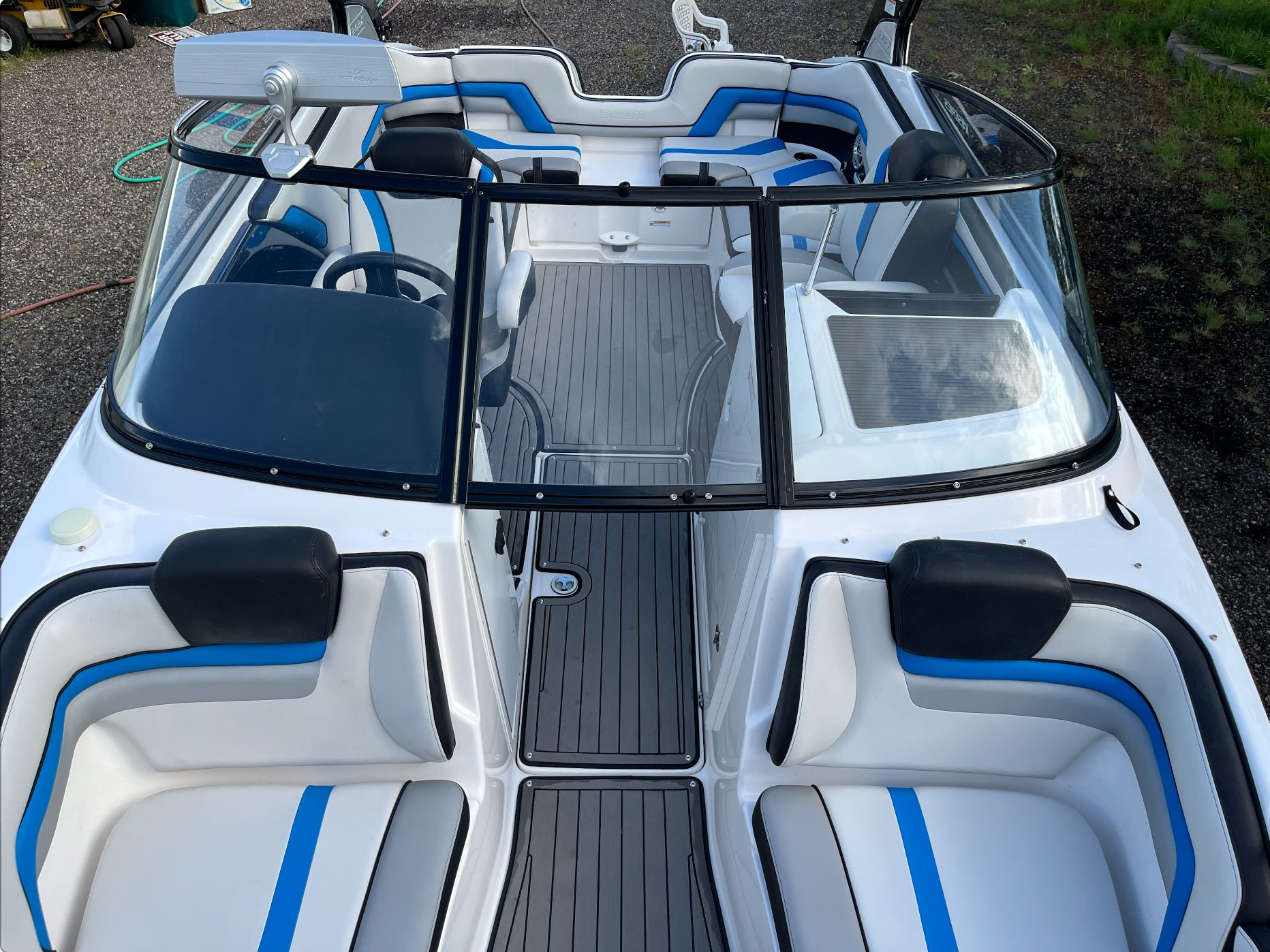 Interior of a 2017 Yamaha 242X E-Series boat with blue accents.
