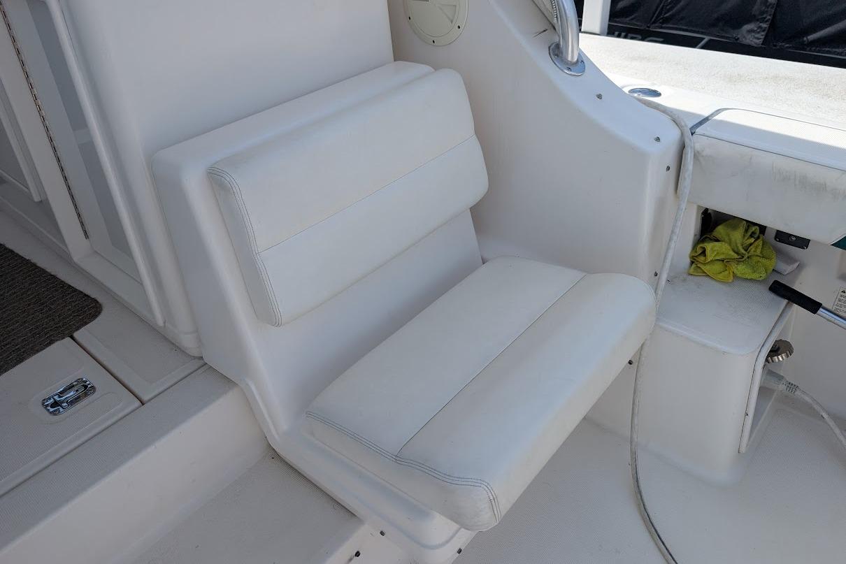 White seating area on a 2000 Pursuit 3400 Express boat interior.