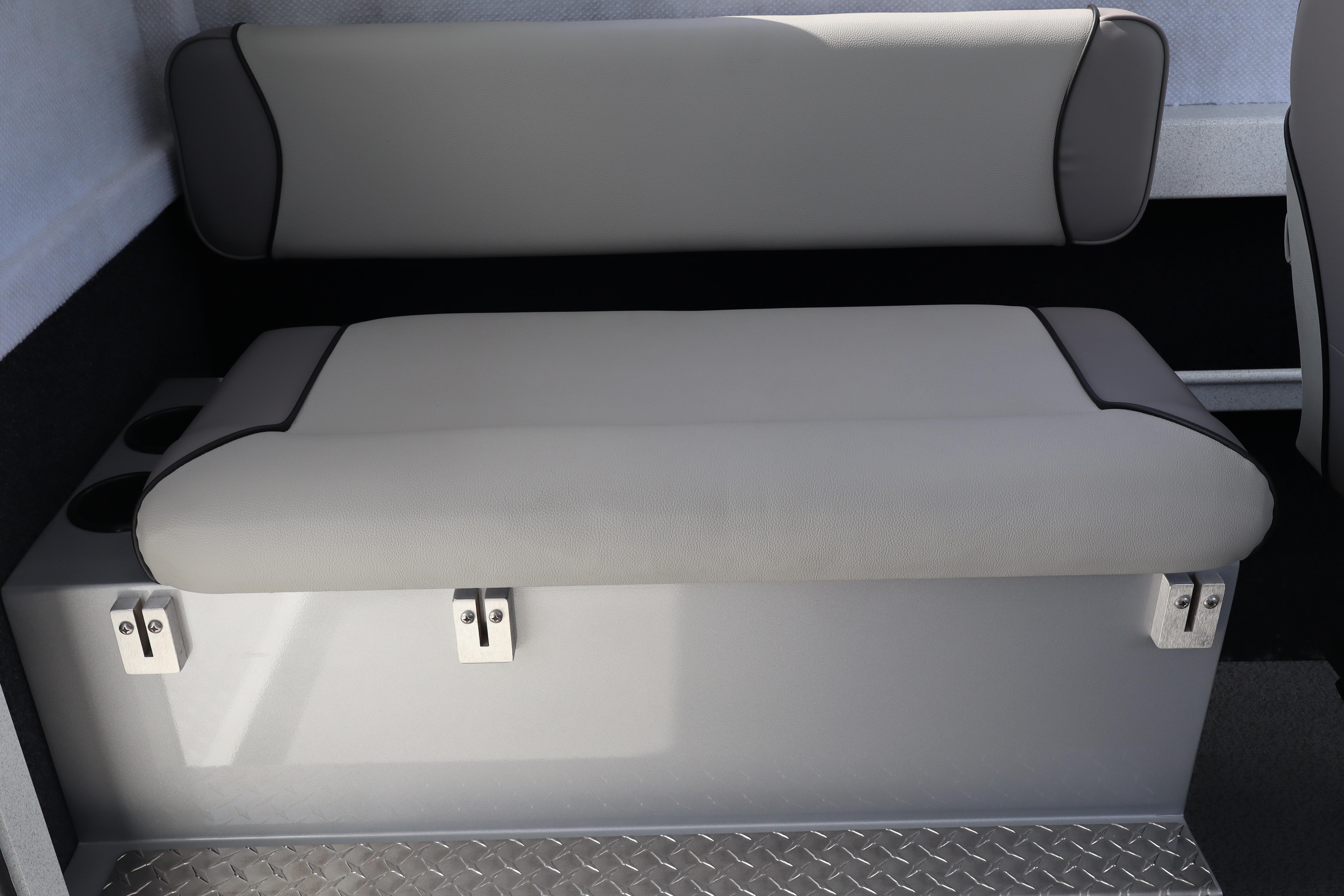 Interior seating of 2026 KingFisher 2425 Escape HT boat, featuring cushioned bench and storage.