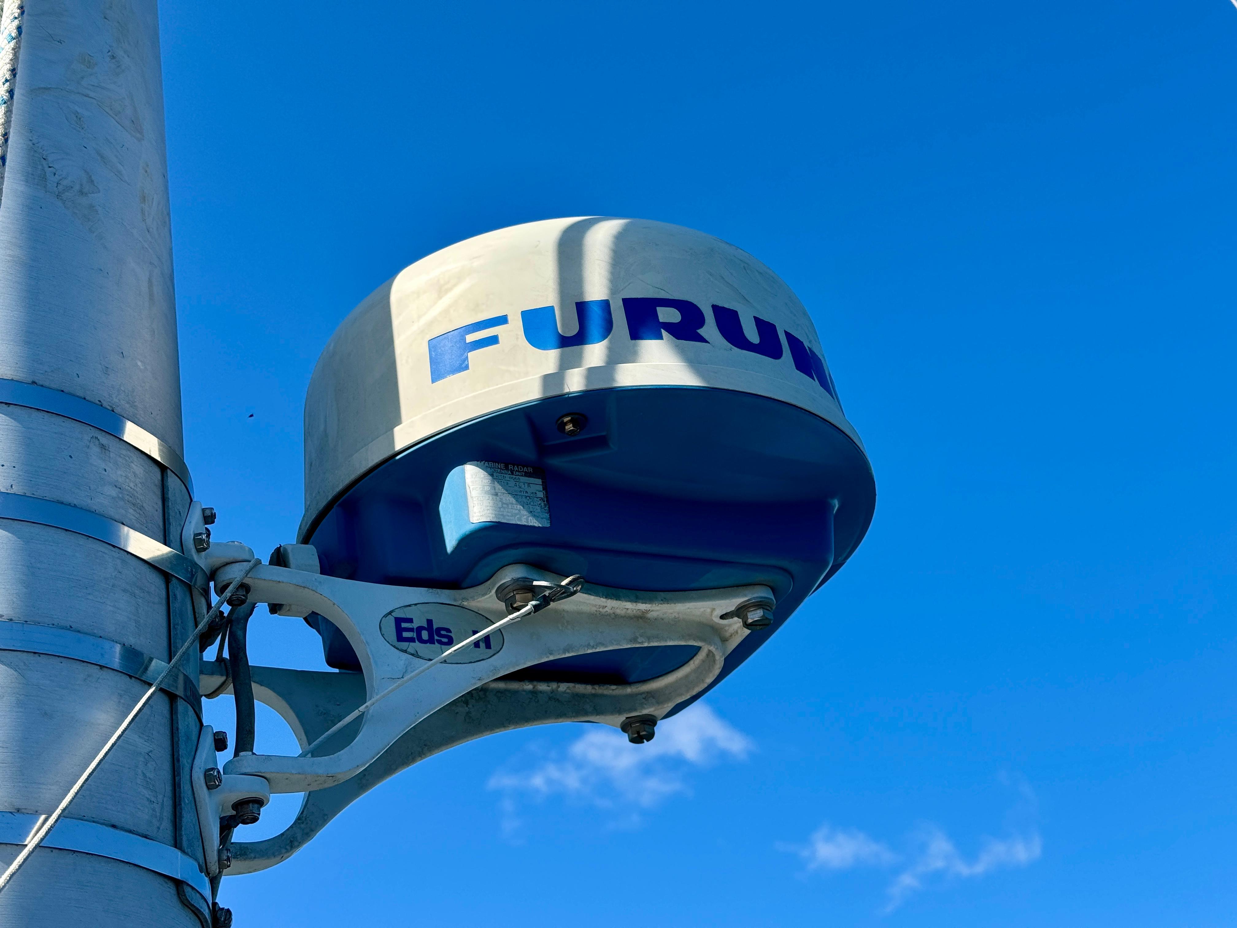 Radar equipment on a Nonsuch 30 Ultra sailboat, 1989 model, against a clear blue sky.