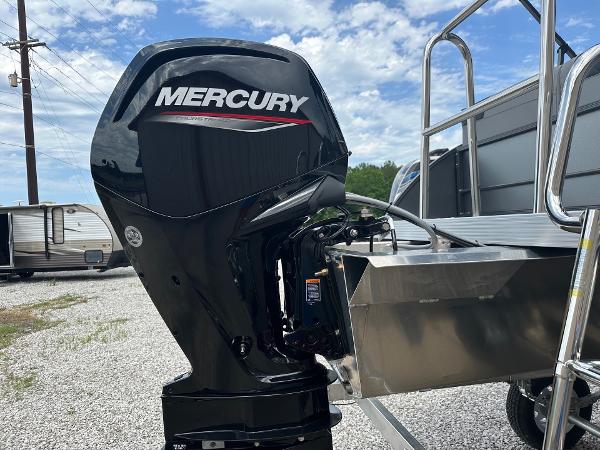 2024 Massimo Marine P-21R with Mercury outboard motor in a gravel lot.