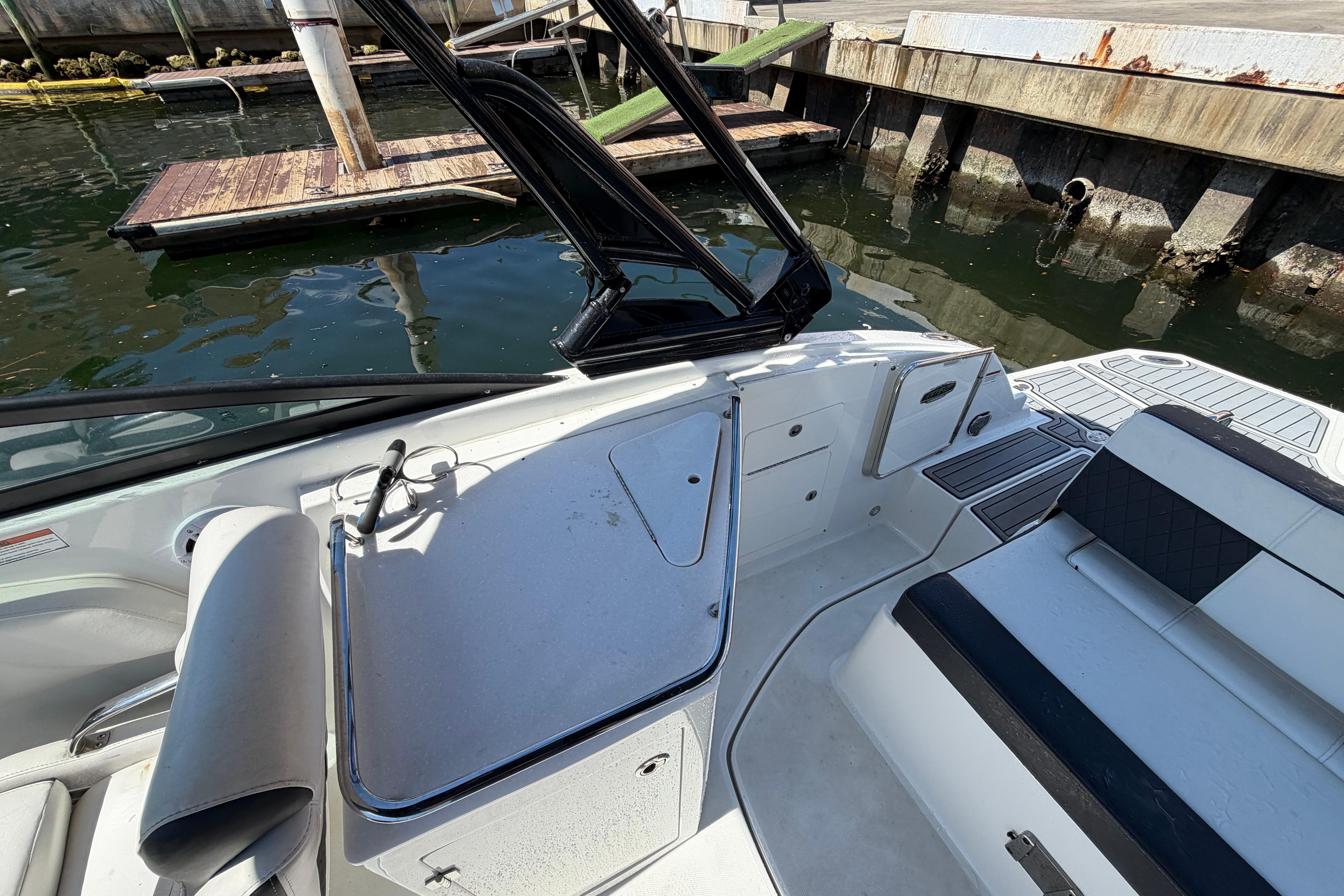 Interior view of a 2022 Monterey M-65 boat docked by the water.